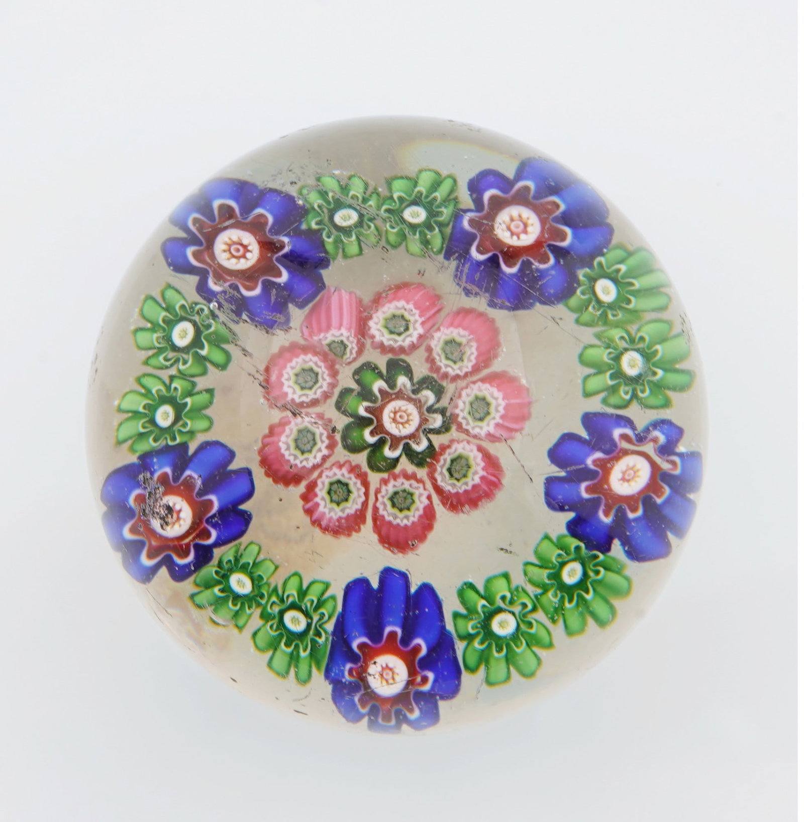 Clichy Millefiori paperweight with flowers, circa 1850: Colorless crystal glass, central millefiori rosette surrounded by rosette rings, Cristallerie de Clichy, France, circa 1850, H 3.3 cm x D 4 cm, scratches, minor chips, provenance: private collection,