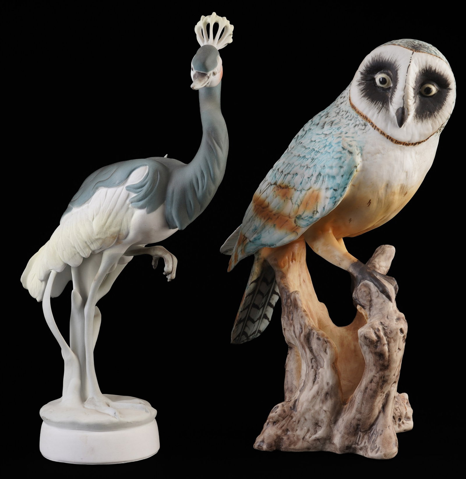 Royal Dux large owl and crowned crane,: porcelain, Bohemia/Czech Republic, green company mark, barn owl sitting on a tree trunk, model no. 24468, H 30.5 cm x W 20 cm, and standing crown crane, H 32 cm x W 17 cm
