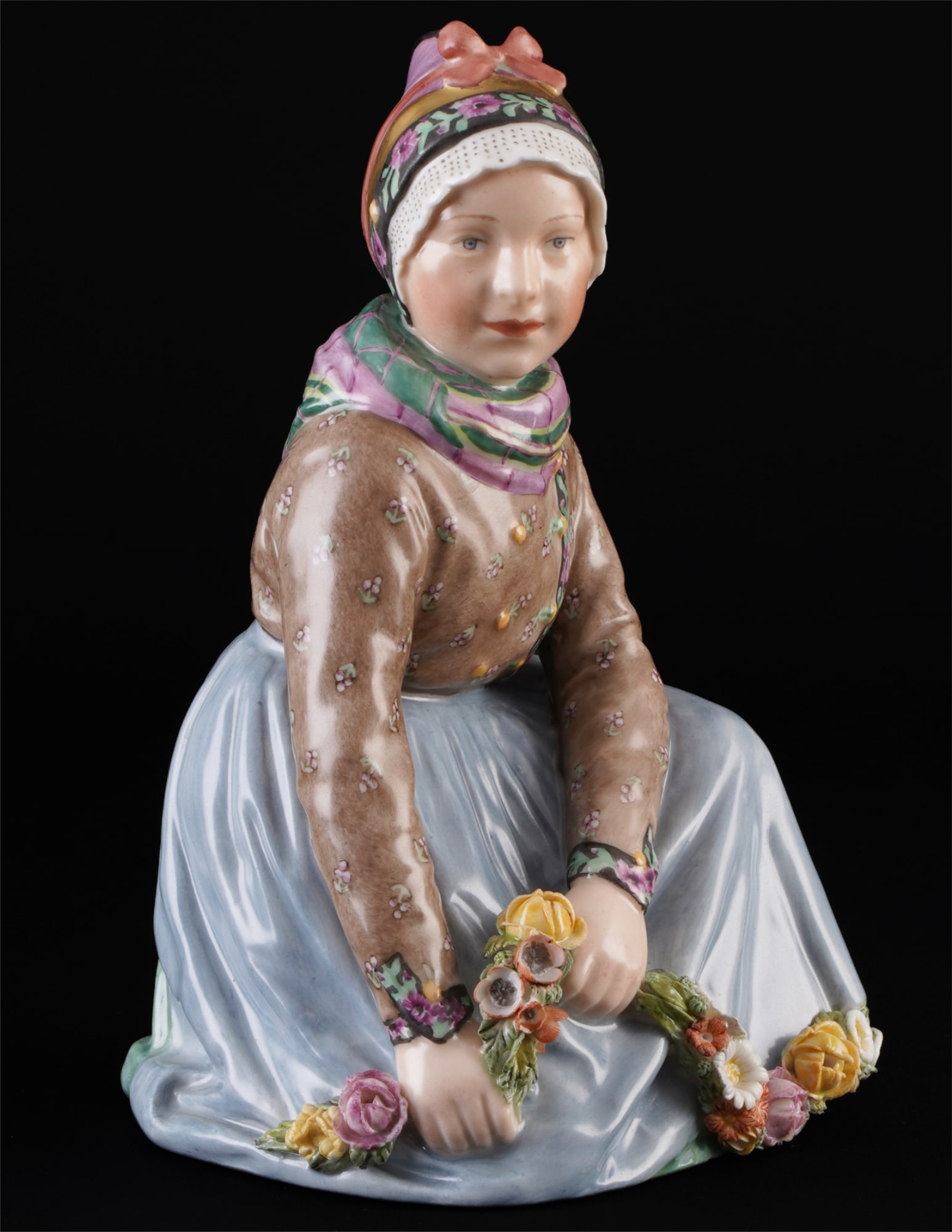 Royal Copenhagen girl from Fan? in traditional costume ? C. MARTIN-HANSEN,: porcelain, Denmark, with green crown mark and blue waves, designed by Carl MARTIN-HANSEN (1877-1941), Fan? girl with flowers, series of children in Danish national costumes, model no. 12413, manufactu