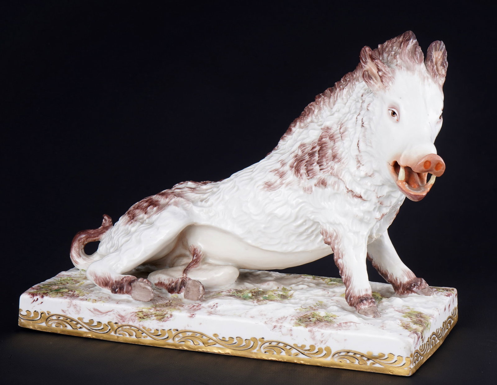 Hoechst wild boar 1762-1796,: porcelain, blue wheel mark 1762-1796, porcelain figure of a reclining wild boar, design attributed to Johann Gottfried BECKER (1713?1807), H 18 cm x W 24 cm x D 11 cm