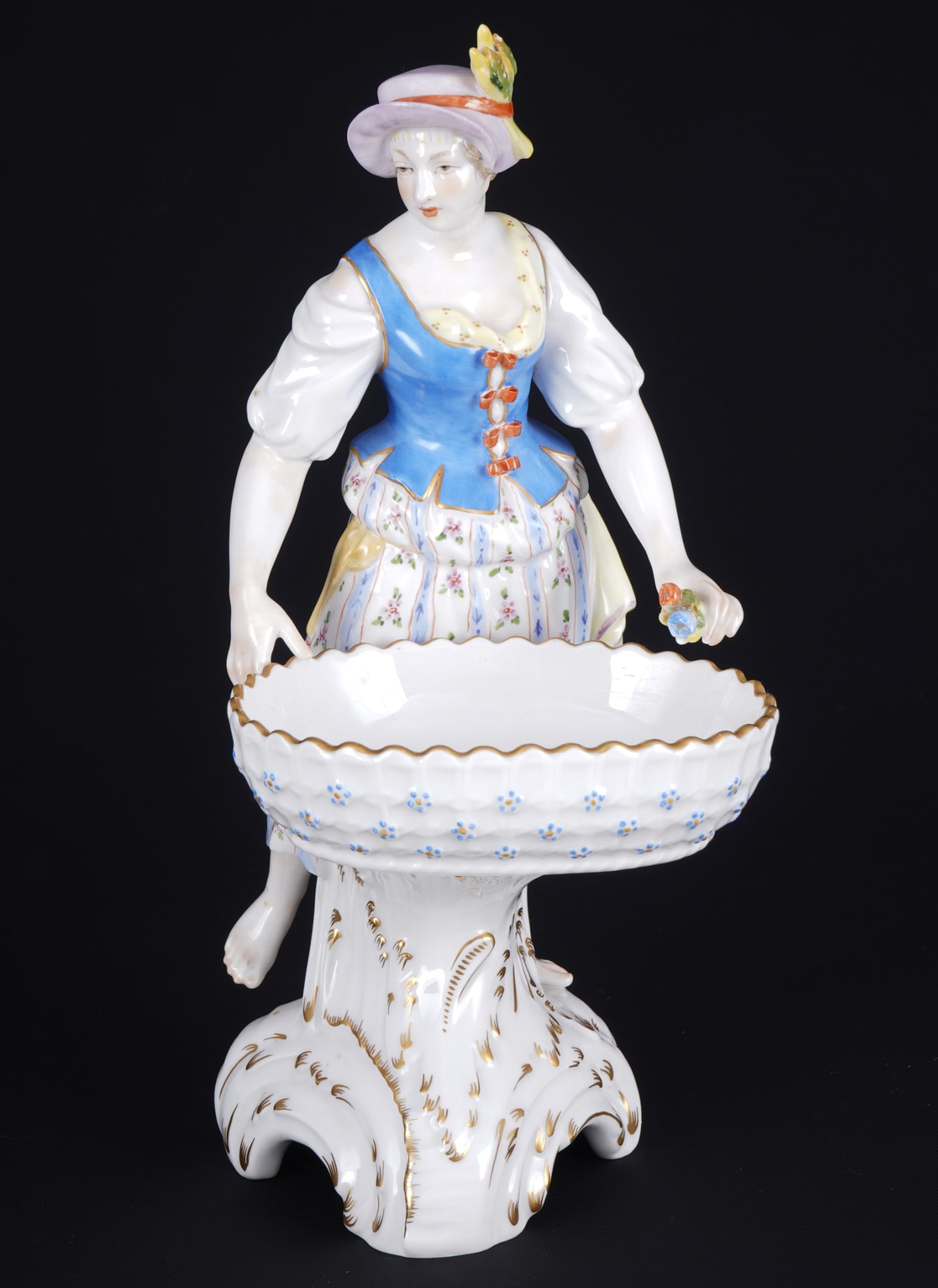 KPM Berlin Allegory of Spring female Gardener - figurative salt cellar - Friedrich Elias MEYER,: porcelain, Royal porcelain Manufactory Berlin, blue scepter mark with red imperial orb, design by Friedrich Elias MEYER (1723-1785), gardener as an allegory of spring, H 23 cm x W 12.5 cm, chips on fl
