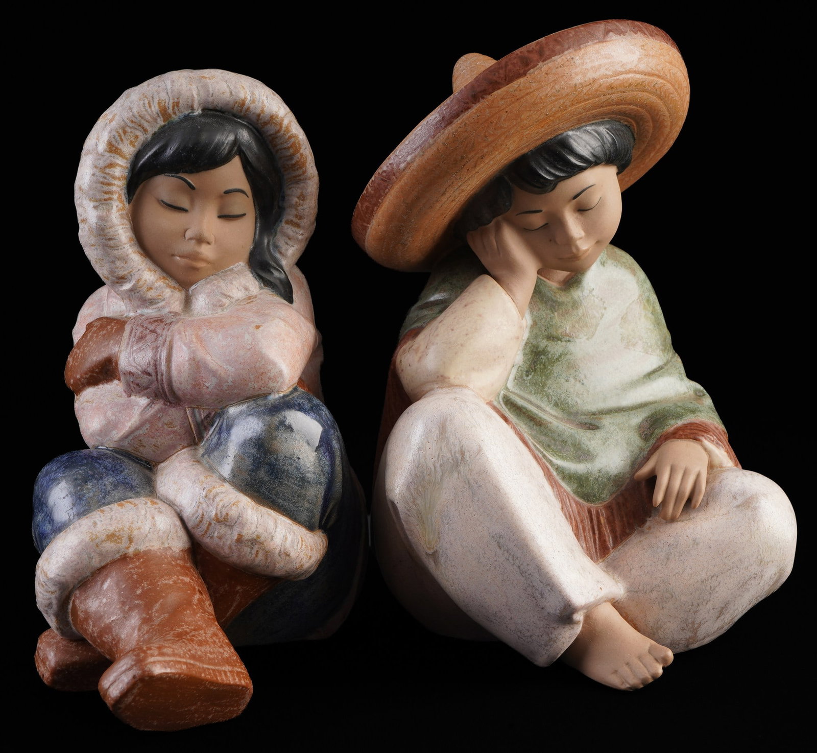 Lladro / Nadal eskimo girl and Mexican boy,: porcelain, Spain, blue company mark, Mexican boy H 19.5 cm x W 13 cm and Eskimo girl, design by Juan Huerta H 18.5 cm x W 18 cm