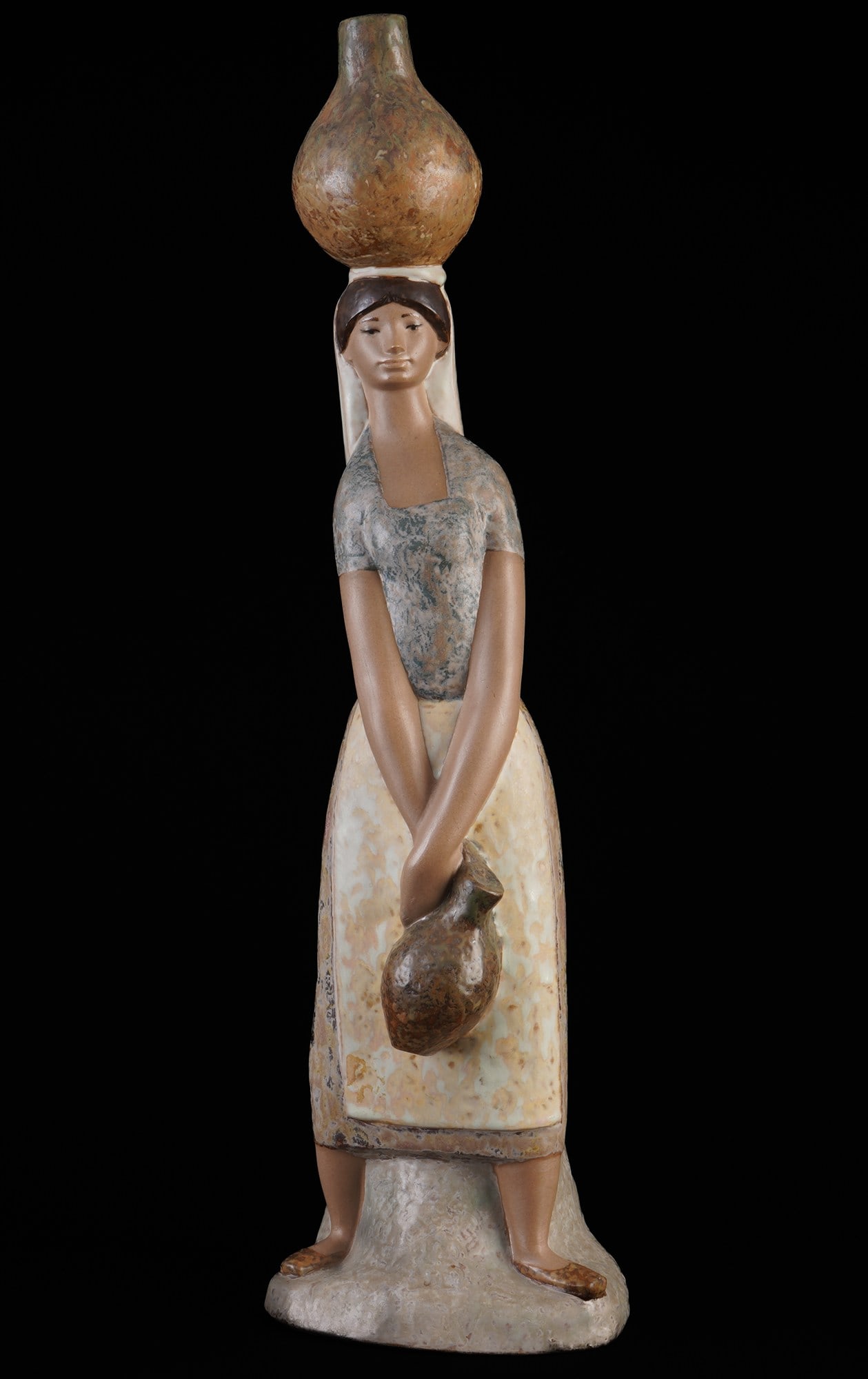 Lladro large water carrier,: porcelain, Spain, blue company mark, design by Fulgencio Garc?a, H 46 cm x W 13 cm