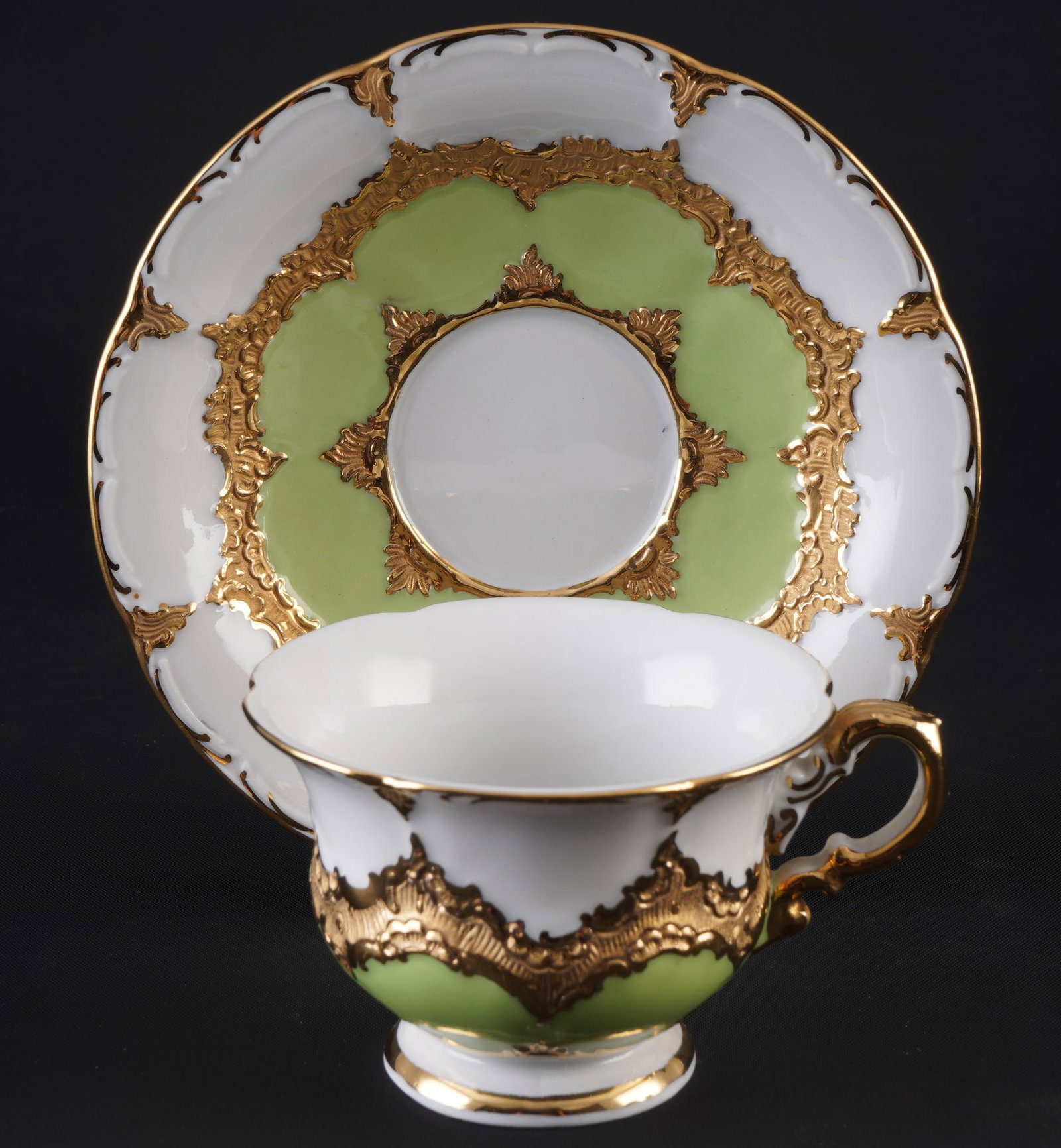 Meissen B-Form may green mocha cup 1st choice,: porcelain, blue sword mark 1st choice, decor B-Form may green, gold bronze, 1x mocha cup H 5 cm x D 7.5 cm, 1x saucer D 12.5 cm