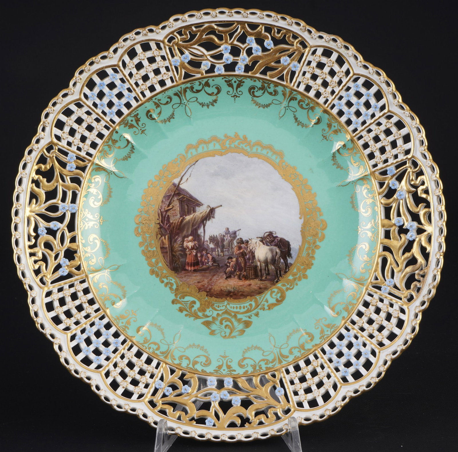 Meissen cutwork splendid plate with rider and rest scenery and turquoise ground 1st choice - after: porcelain, blue sword mark 1st choice, knob mark 1860-1924, decor: pastoral resting scene with horses in front of a lively tavern with numerous travelers after Philips Wouwerman (1619-1668), plate rim