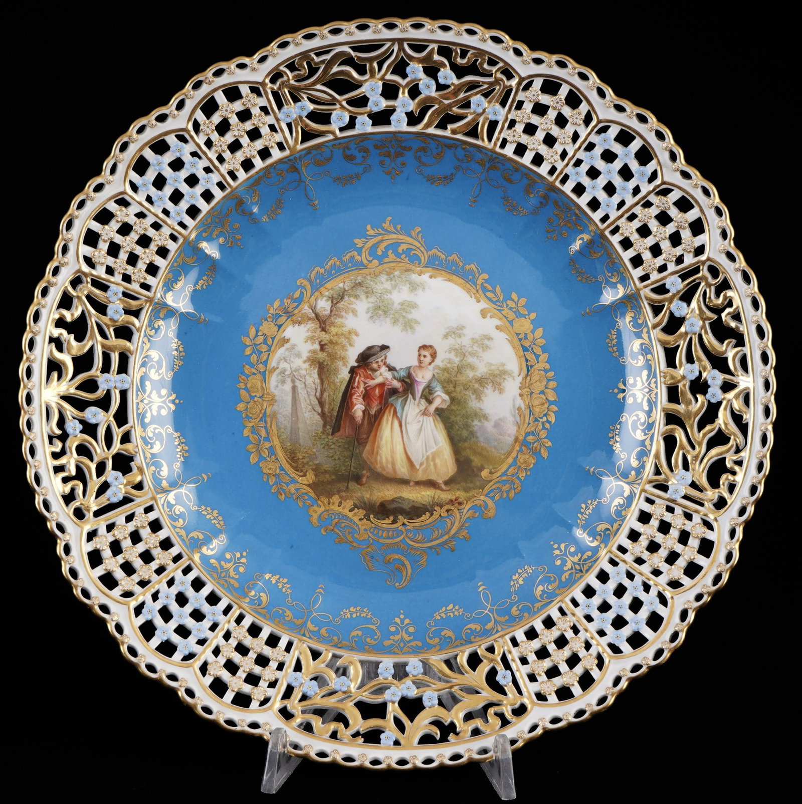 Meissen cutwork splendid plate with strolling couple in park landscape and light blue ground 1st: porcelain, blue sword mark 1st choice, knob mark 1860-1924, decor: elegant park scene - a strolling couple in a romantic park landscape after Jean-Antoine WATTEU (1684-1721), plate rim with light blue
