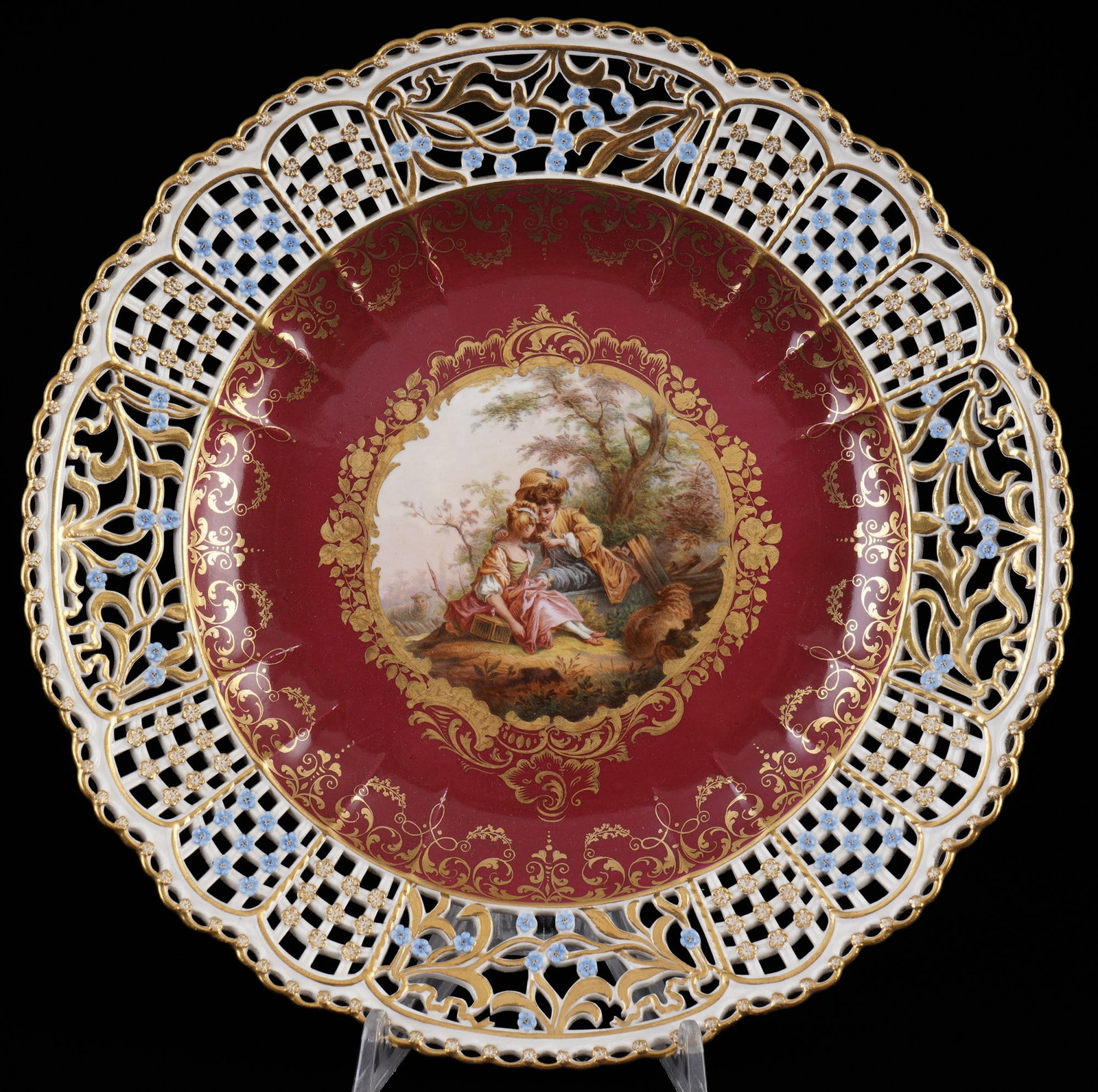 Meissen cutwork splendid plate with dreamy lovers scenery in forest landscape and purple ground 1st: porcelain, blue sword mark 1st choice, knob mark 1860-1924, decor romantic pastoral scene - young lovers in an intimate pose sitting in an idyllic forest landscape after Jean-Antoine WATTEU (1684-1721