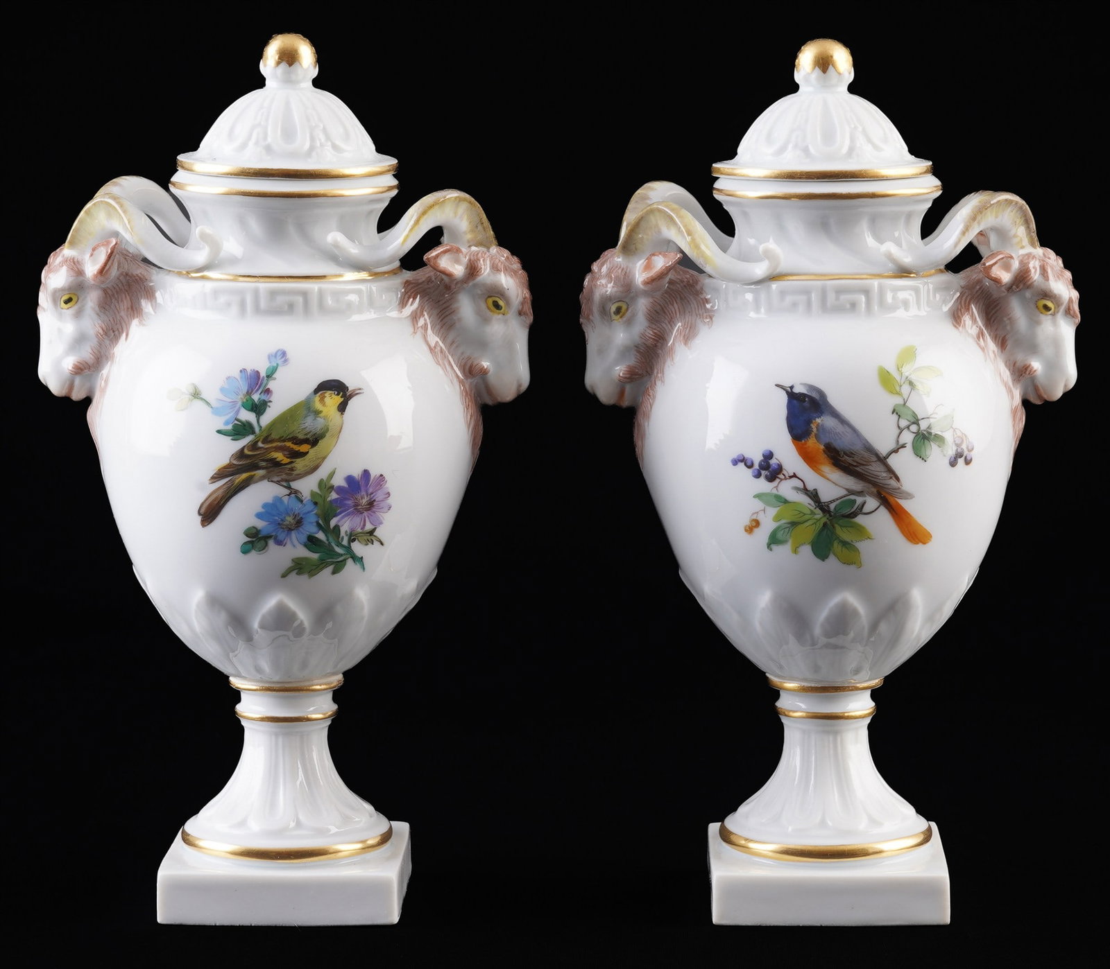 Meissen Birds pair of ram's head - lidded vases 1st choice,: porcelain, blue sword mark 1st choice, Pfeiffer period 1924-1934, decor on the front with Birds and on the back with Flower Bouquets, with ram's heads, continuous meander frieze, 2x H 18 cm x D 9.5 cm