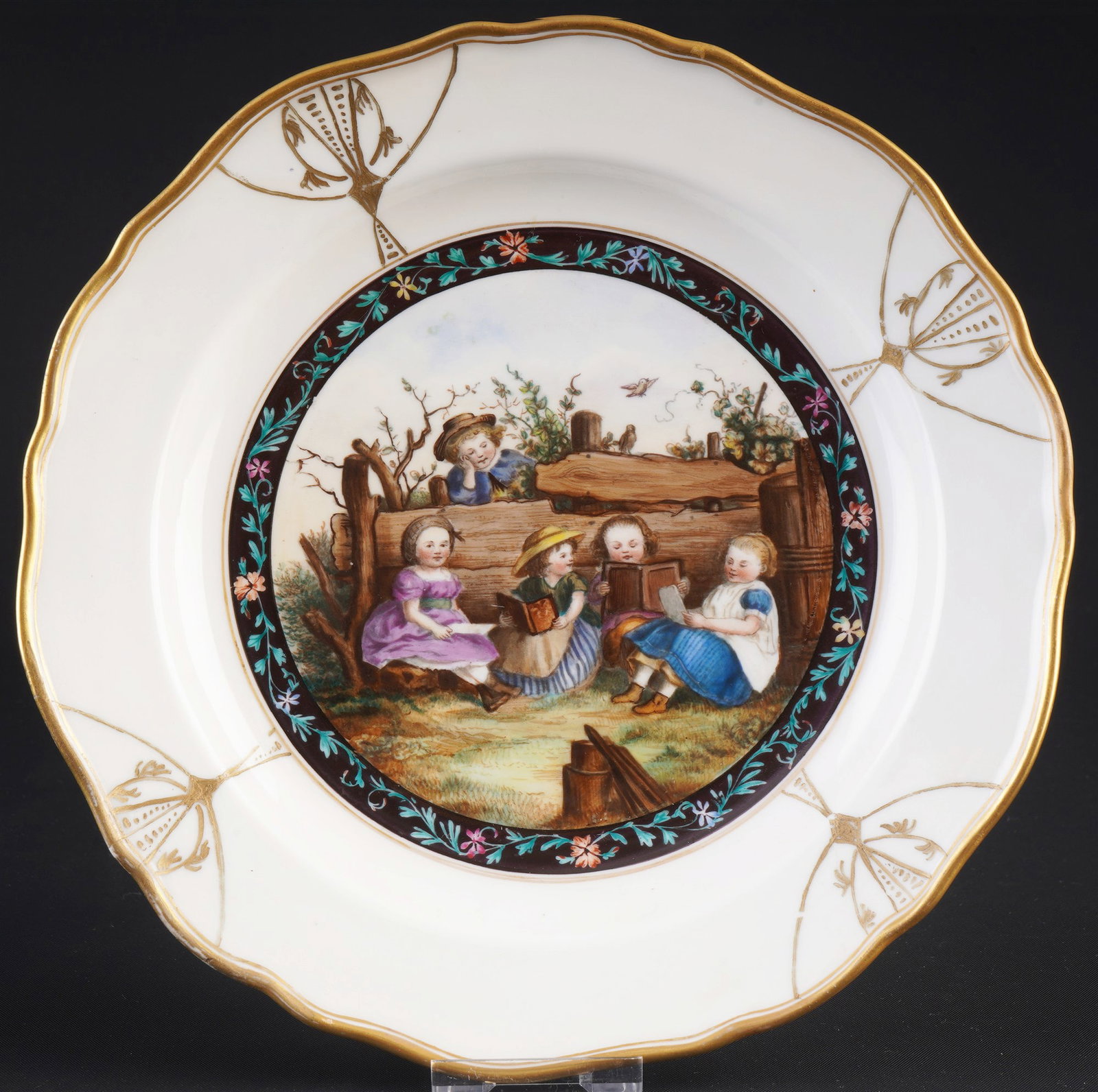 Meissen c. 1900 decorative plate with group of children,: porcelain, blue sword mark with two grinding strokes 2nd choice, knob mark 1860-1924, decoration: children's group / reading scene, floral border all around, hand-painted, D 21 cm, rubbed