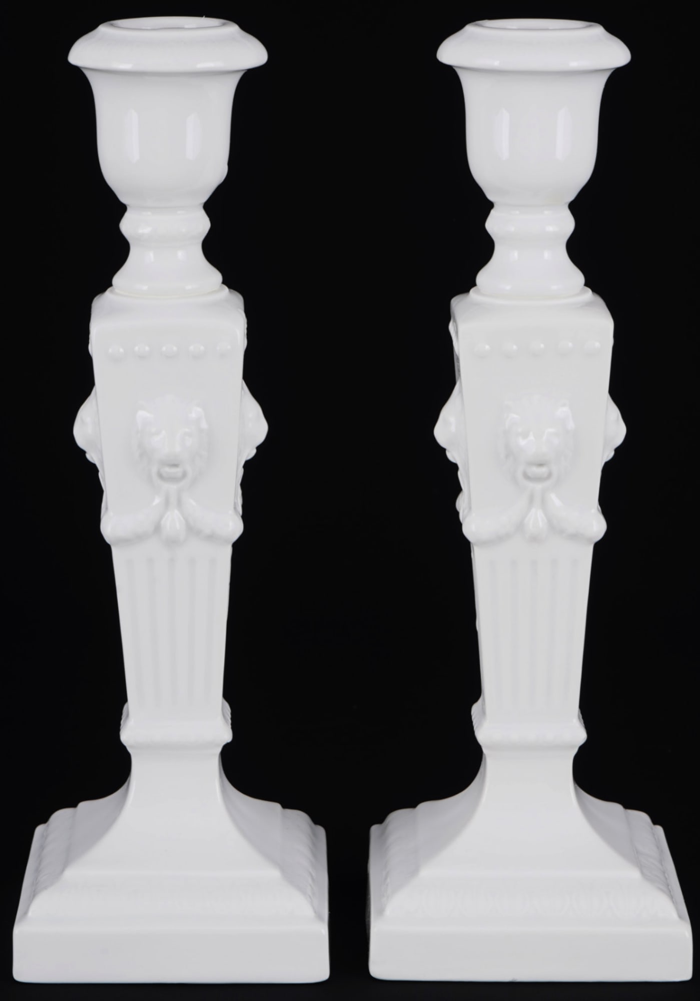 Royal Copenhagen pair of Lion Head candlesticks,: porcelain, Denmark, with green company mark and blue waves, with grinding stroke, white decor with lion heads, model no. 15, 2x H 22.5 cm x W 7.5 cm