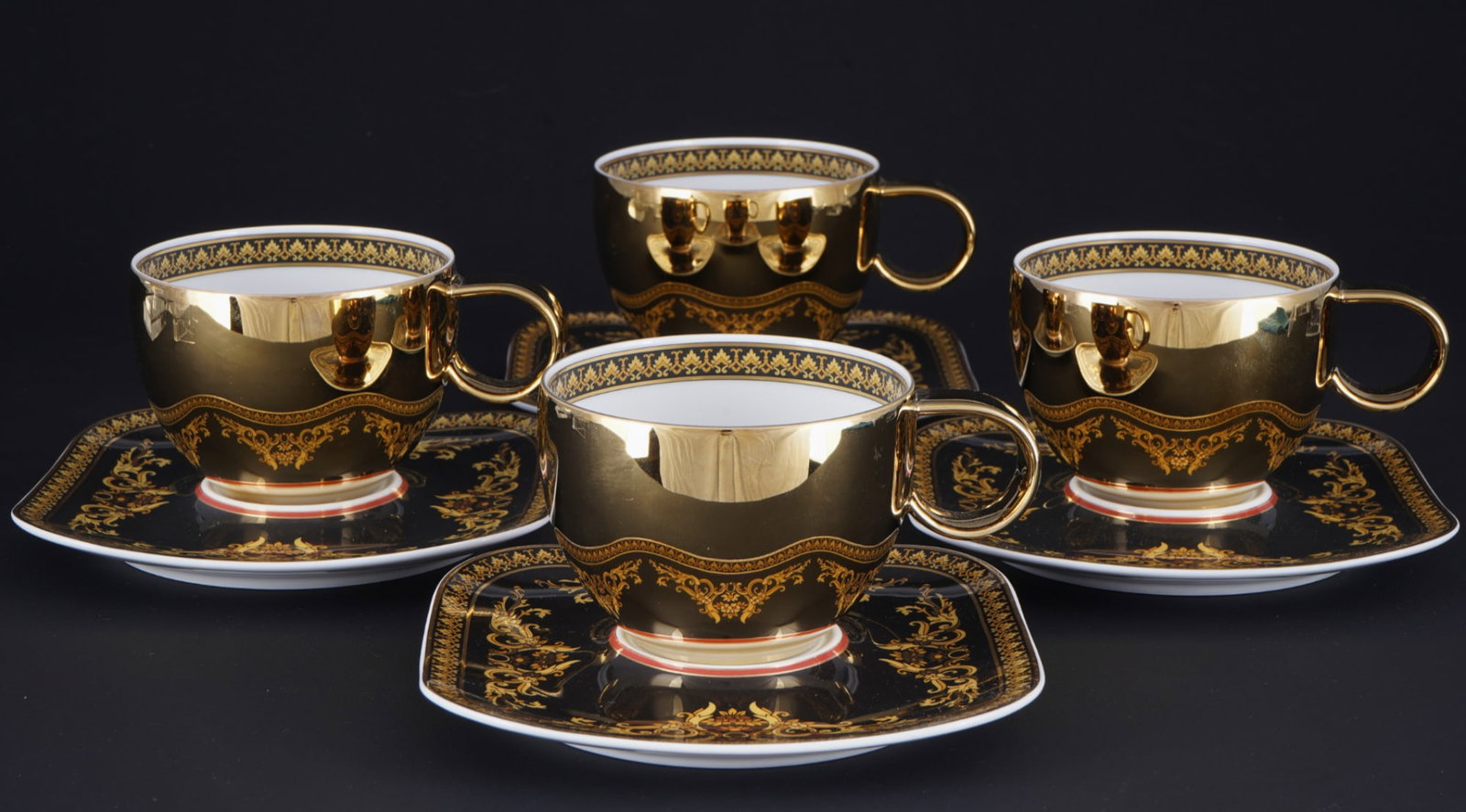 Rosenthal Versace Medusa 4 coffee cups,: porcelain, black and gold company mark, decor Versace Medusa, shape Icarus, design by Paul WUNDERLICH (1927-2010), 4x coffee cups H 6.5 cm x D 9 cm, 4x saucers D 15 cm