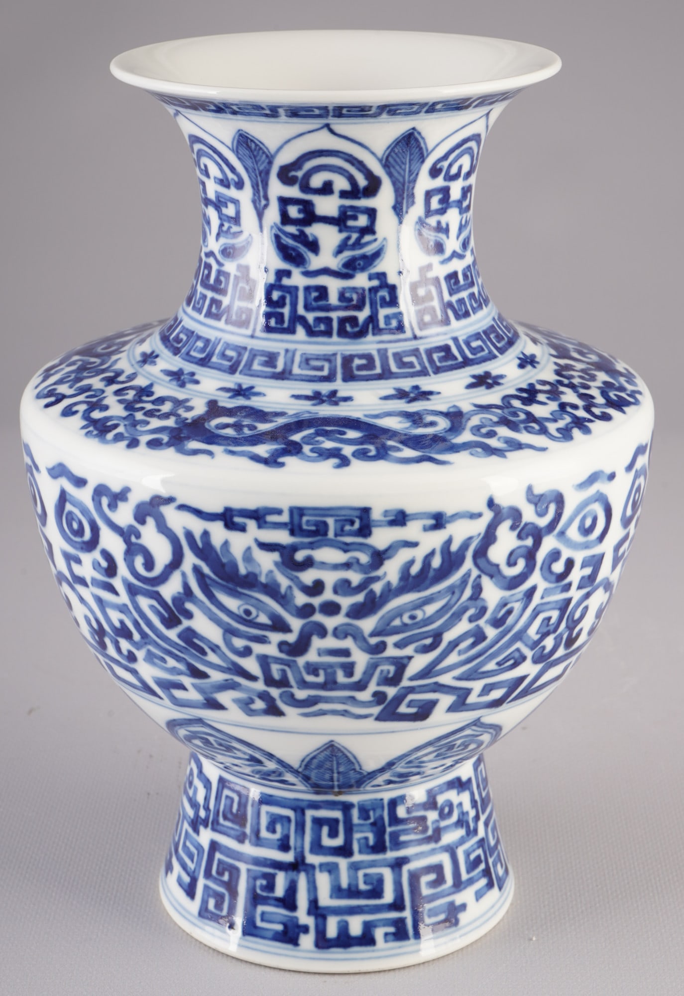 Blue and white vase with Qianlong seal mark, China: Porcelain, China, a blue and white vase with a dragon motif in the shape of a Zun, H 24.3 cm x D 16.5 cm