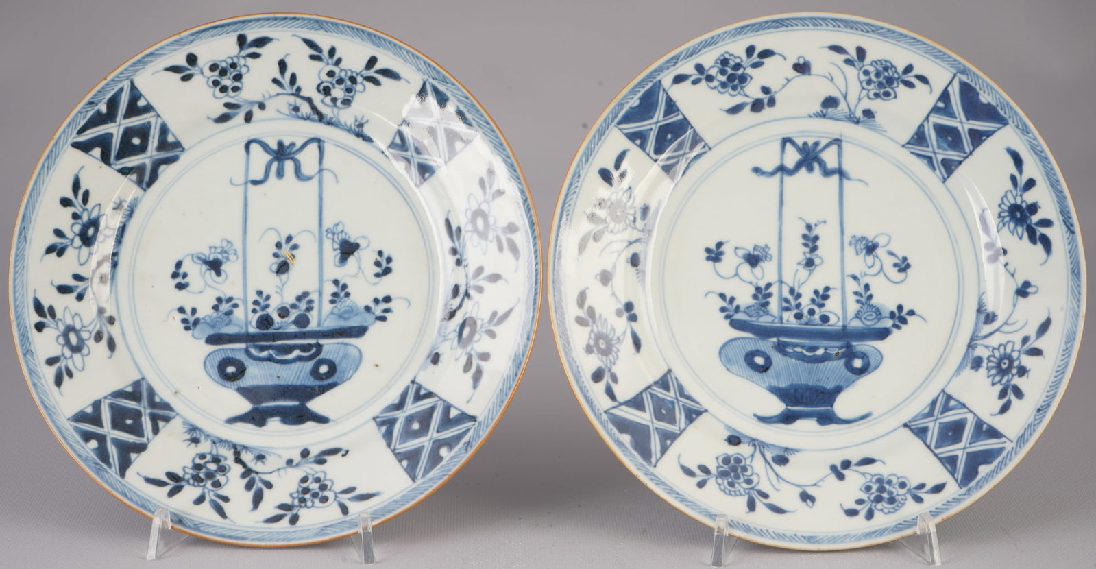 Pair of blue and white plates, China, Qianlong period,: Porcelain, China, Qing Dynasty, Qianlong Period (1735–1796), pair of plates with blue and white painting, decorated with various flowers, 2 x D 22.7 cm, good condition