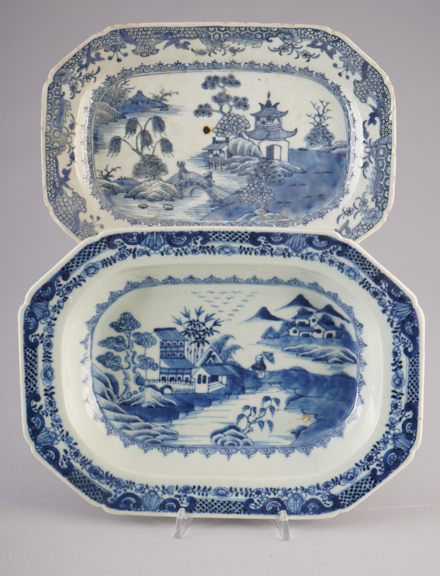 Pair of blue and white rectangular plates, China, Qianlong period,: Porcelain, China, Qing Dynasty, Qianlong period (1735–1796), a pair of blue and white rectangular plates painted with a landscape scene featuring pavilions, scholars, mountains and a bridge, H 4.6 c
