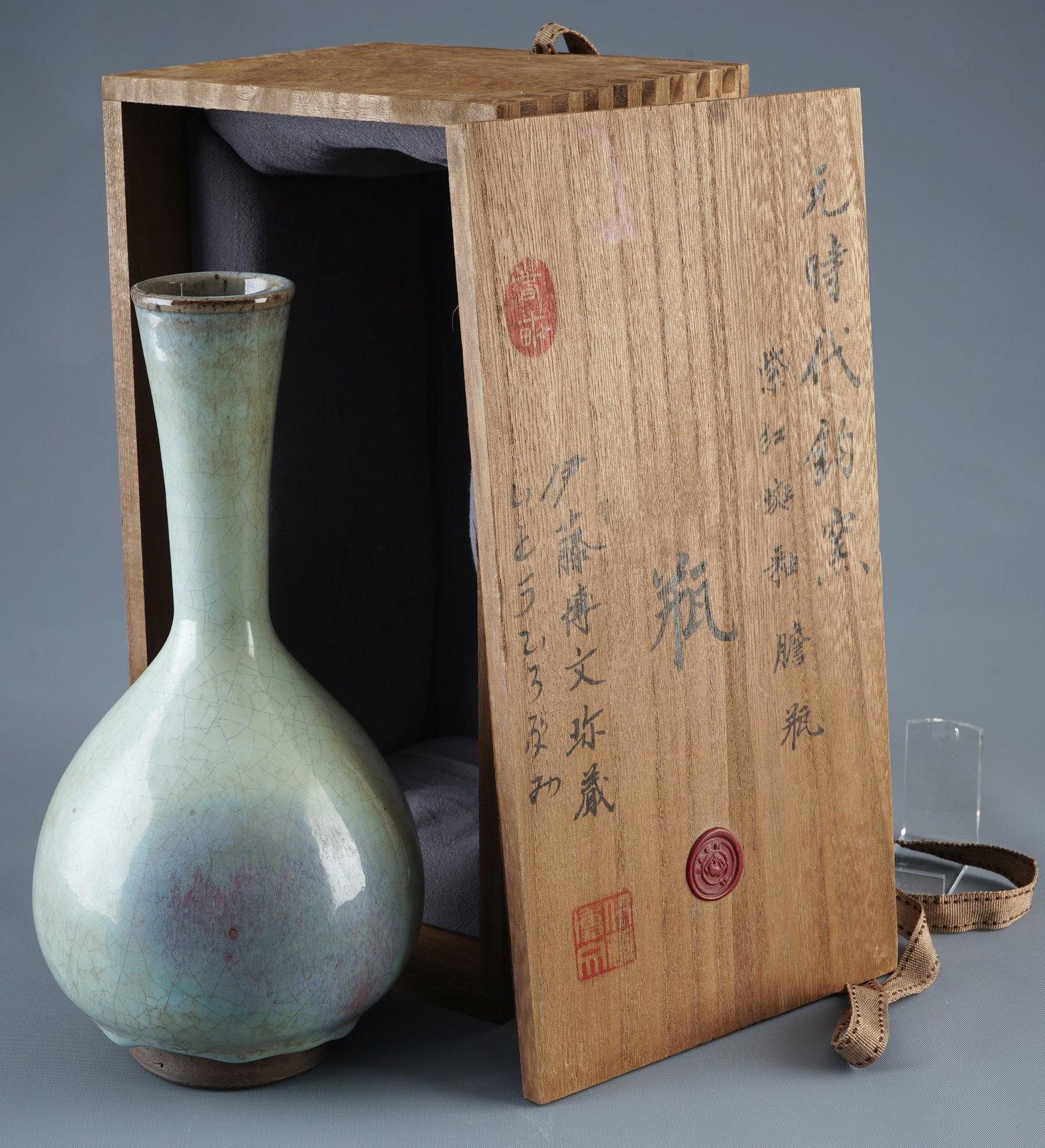 Vase with Jun glaze and crackle glaze, China, probably Song Dynasty,: Porcelain, China, probably Song Dynasty (960–1279), long-necked vase with pear-shaped body, slightly milky Jun glaze and dense natural ice-cracking network, dark foot, H 25.5 cm x D 13 cm, signs of 