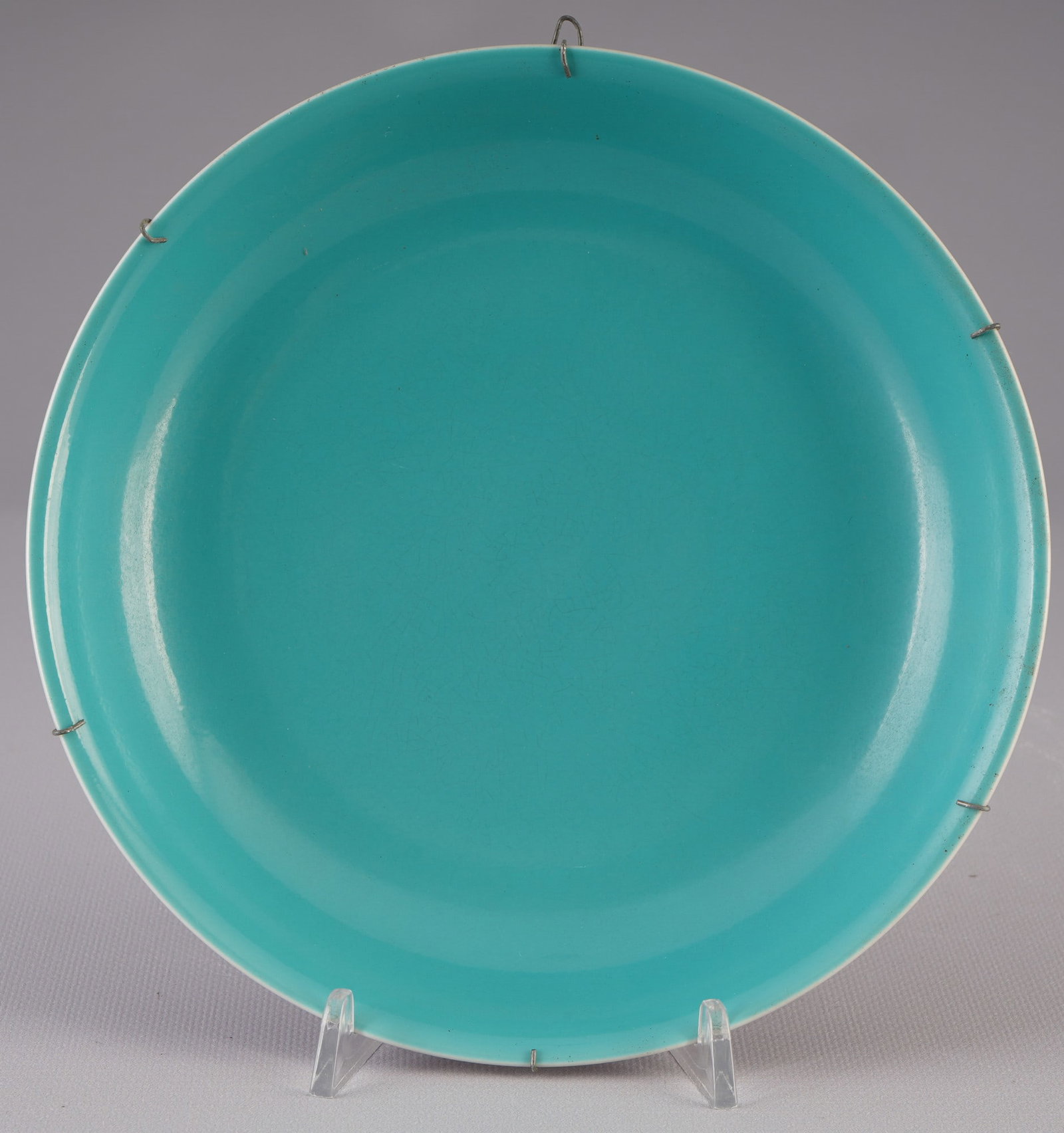 Rare light purple glazed plate, China Yongzheng period,: Porcelain, China, Qing Dynasty Yongzheng period (1723-1735), an elegant plate, covered on the outside with a uniform light violet glaze of exceptional clarity and depth, the glaze is flawless and show