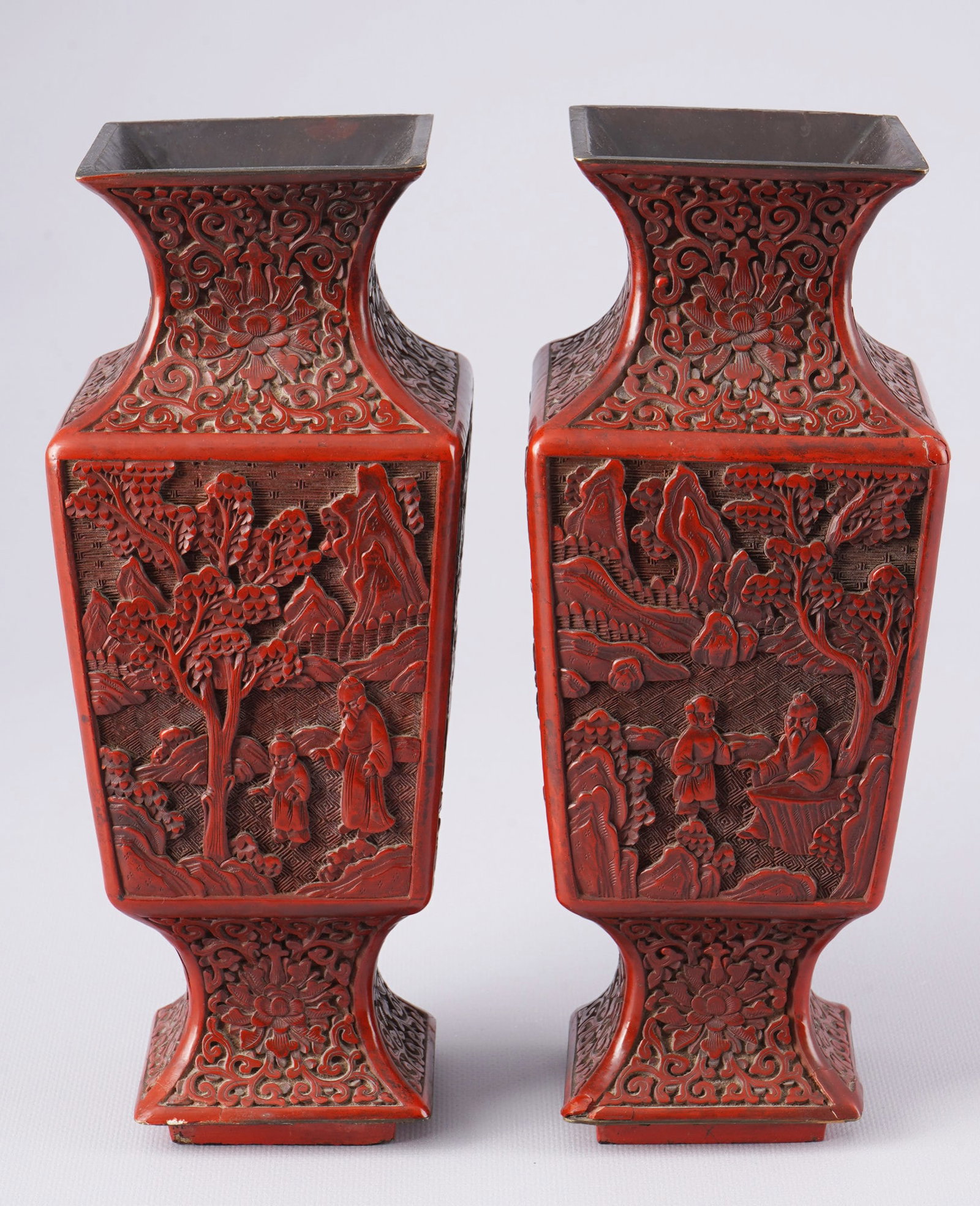 Pair of red lacquer vases with figurative landscape scenes, China Qing Dynasty,: Pair of red lacquer vases, carved lacquer, China Qing Dynasty (1644–1911), a pair of finely carved lacquer vases with figurative landscape scenes, the surface is covered with deep red lacquer and de