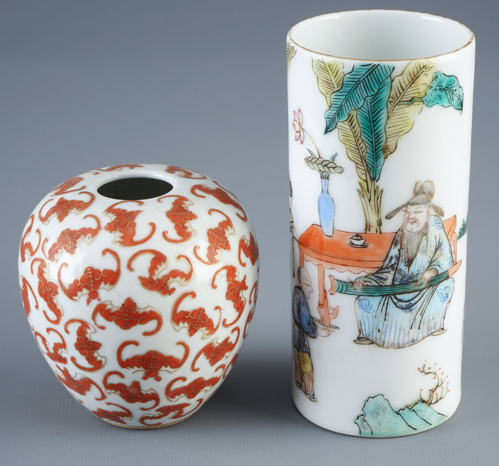 Two porcelain objects, China, 19th century,: Porcelain, China, 19th century, two Famille Rose porcelain objects with figural scenes and bats, H 12.8 cm x D 5.9 cm, H 8 cm x D 7.8 cm
