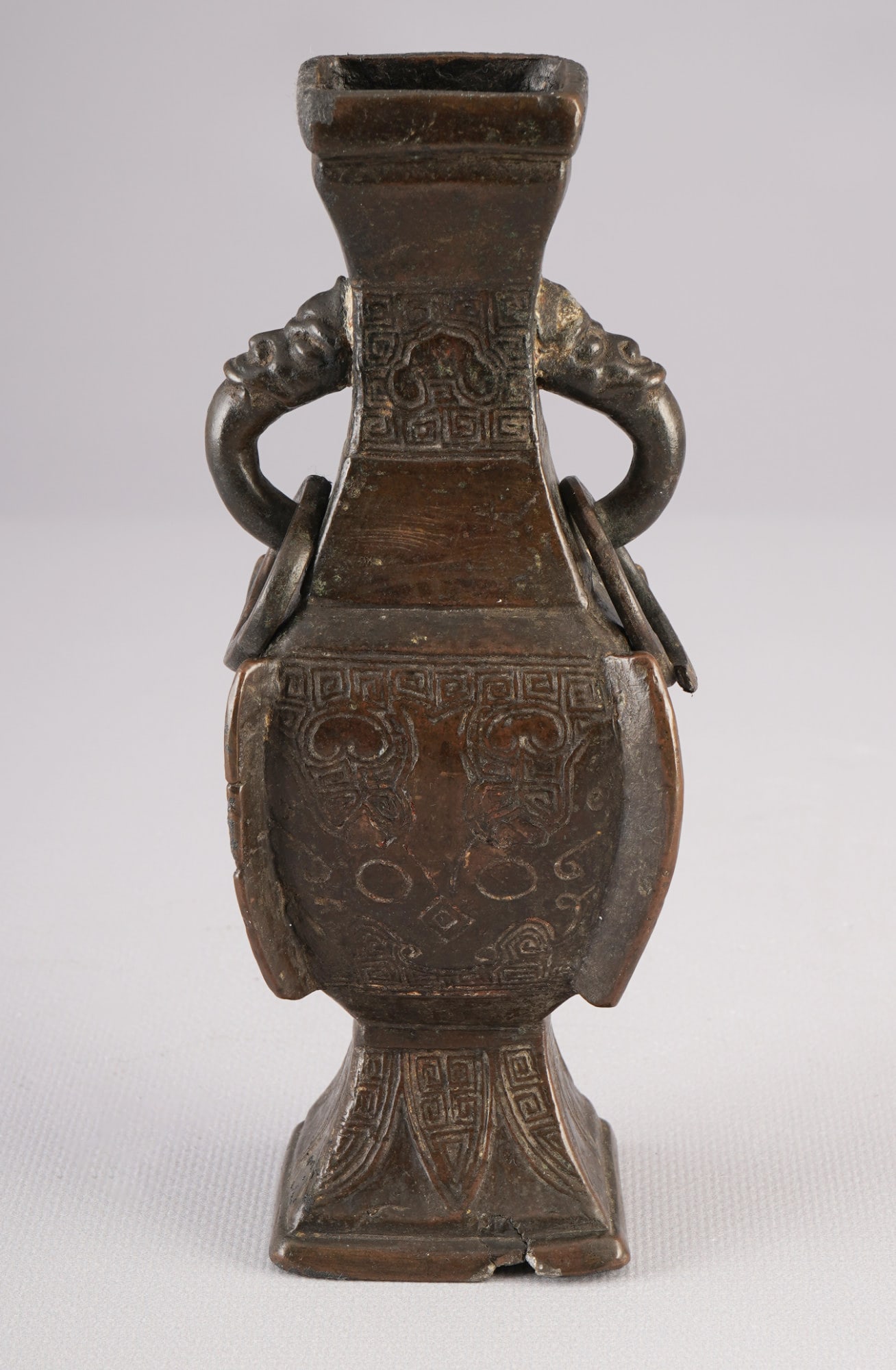 Archaic bronze zun, China, Ming Dynasty: Bronze, China, Ming Dynasty (1368–1644), a ritual vessel (zun) in an archaizing style, with relief-decorated, projecting "wings" (so-called chuji) at the shoulder, the body is decorated with classic