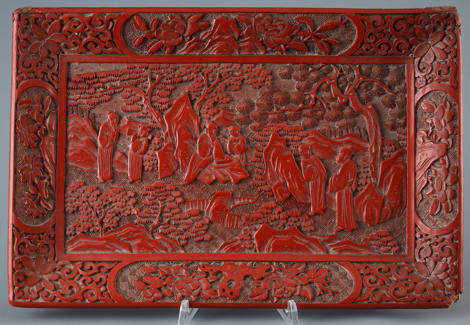Rectangular tray made of red lacquer, China, Qing Dynasty,: Red lacquer, China, Qing Dynasty (1644–1911), wooden support, coated several times with red lacquer, deeply carved (Tihong technique), depicting a landscape and scholars among rocks, pines, and flow