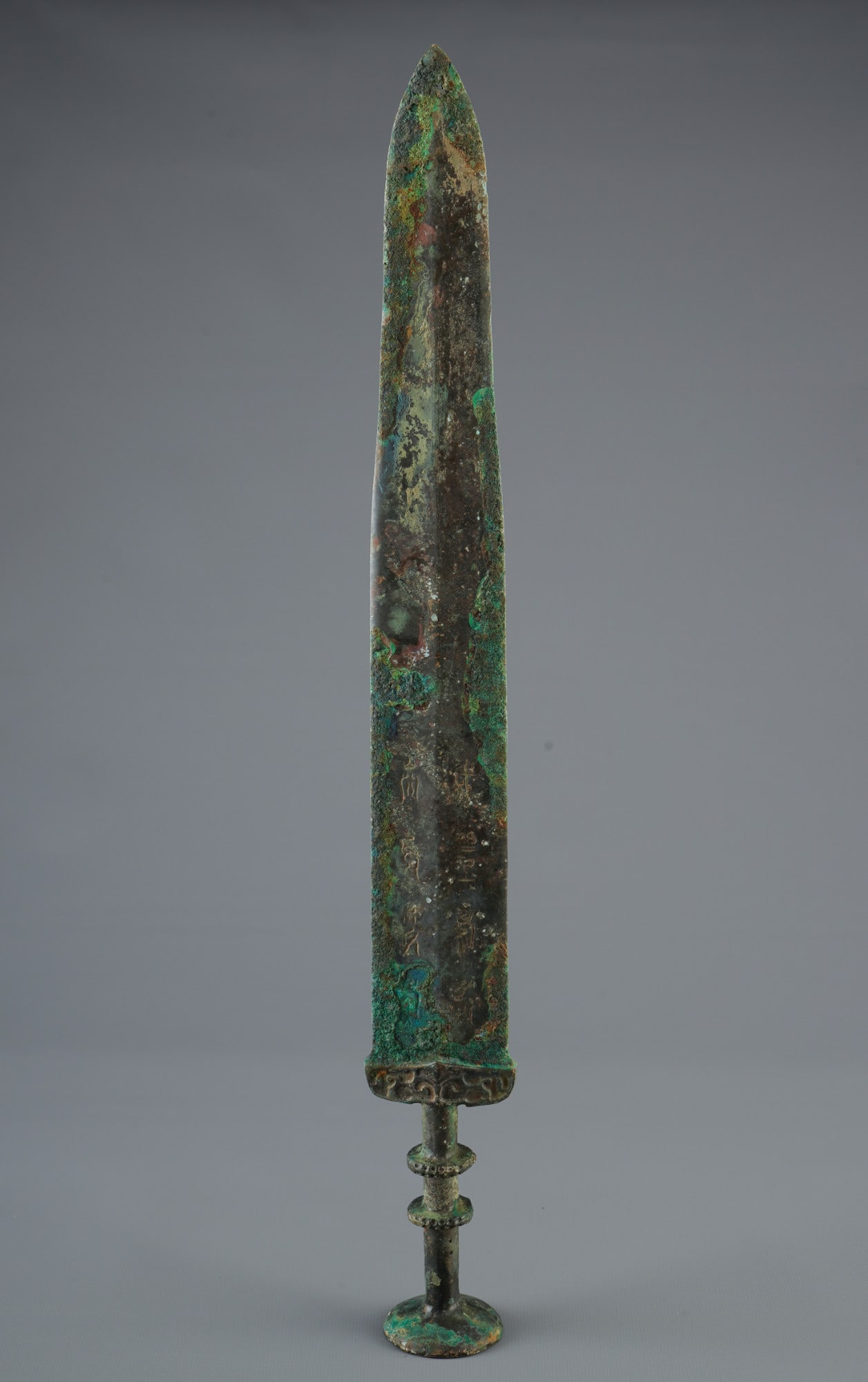 Bronze sword, China, probably from the Spring and Autumn period,: Bronze, China, probably from the Spring and Autumn period (770–476 BC), bronze sword, slender, lanceolate blade with a raised central ridge, cylindrical grip with two rings, crossguard with animal