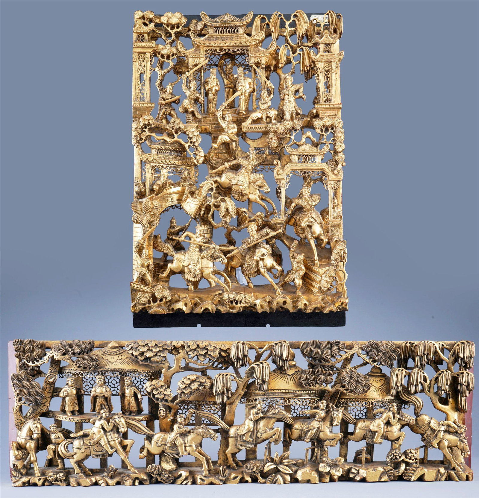 Pair of carved panels with birds, China: Pair of carved wooden panels in relief, openwork, red lacquered and gilded, depicting a temple with warrior cavalry, H 24 cm x W 80 cm x D 6 cm, H 45 cm x W 29 cm x D 4.5 cm