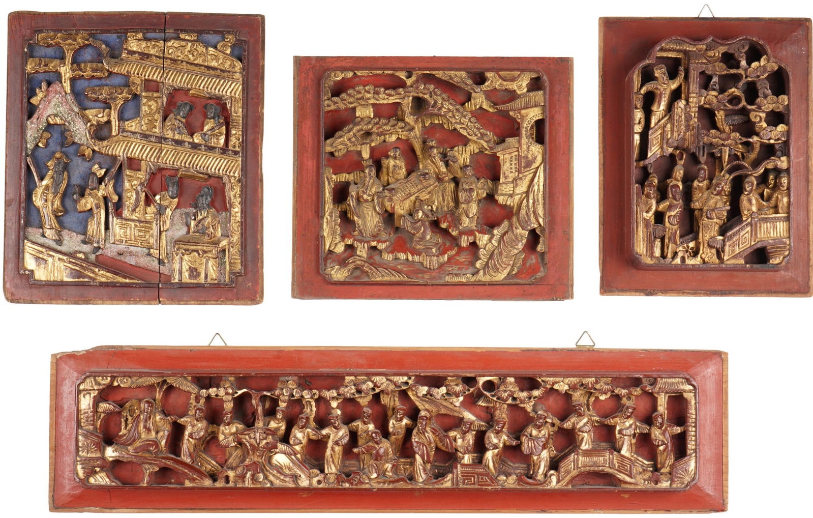 Four carved panels, China, Republic period around 1930,: Elaborately crafted wooden reliefs in openwork technique, red lacquered and partially gilded, China, Republic period, circa 1930. Depicting various temple scenes with numerous character figures. Dimen