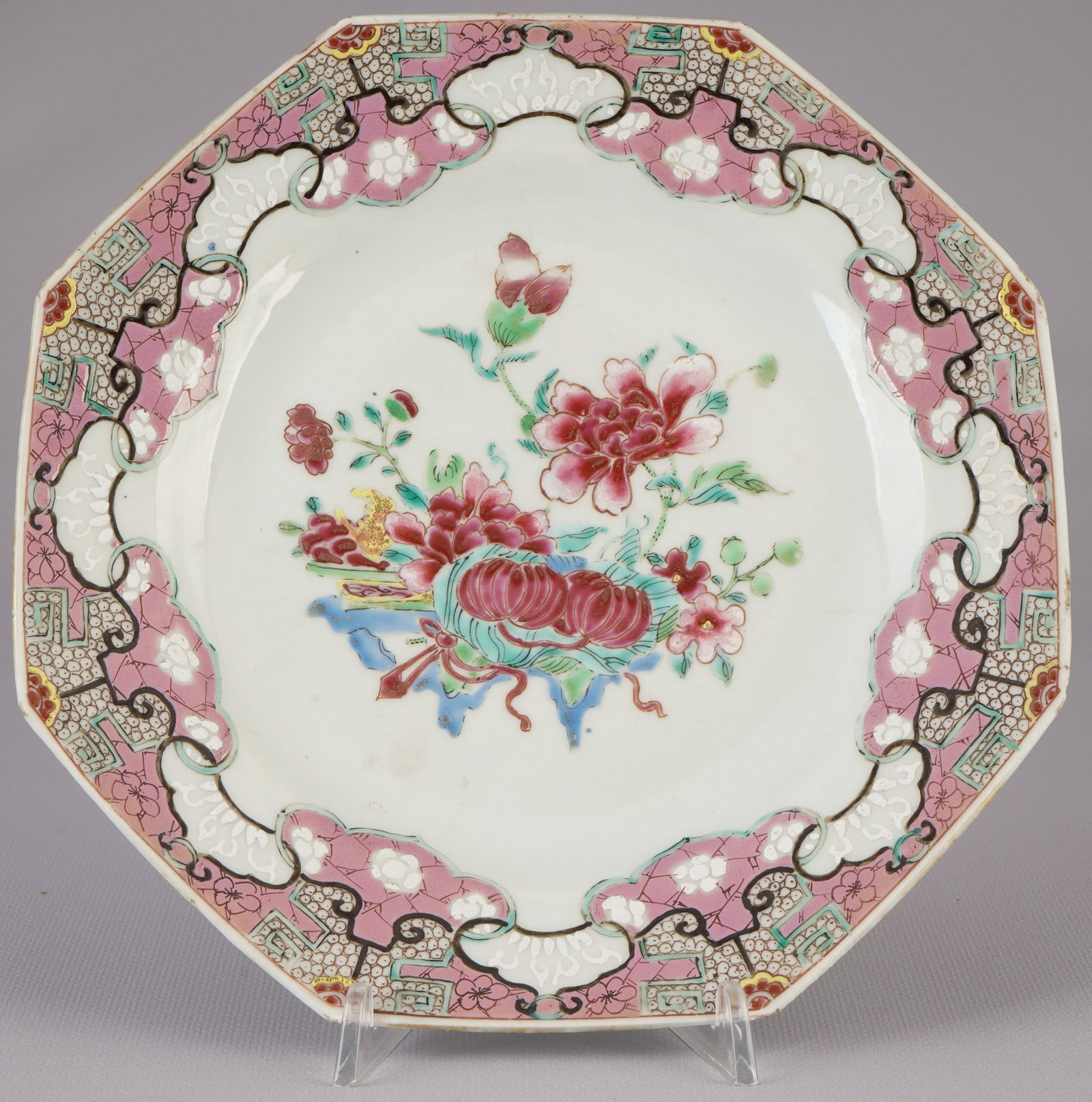 Octagonal Famille Rose plate, China, 18th century: Porcelain, China, 18th century, octagonal famille rose plate with floral motif, diameter 22.8 cm, one hairline crack, chip on the rim