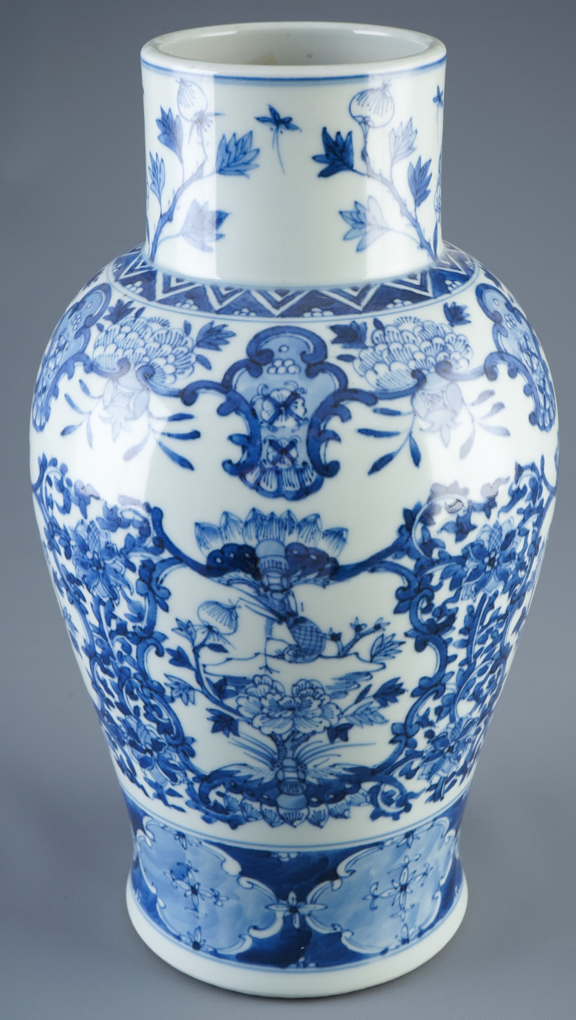 Blue and white vase, China, Qing Dynasty: Porcelain, China, Qing Dynasty (1644-1911), a blue and white vase decorated with birds and various flowers, H 32.5 cm x D 17.5 cm