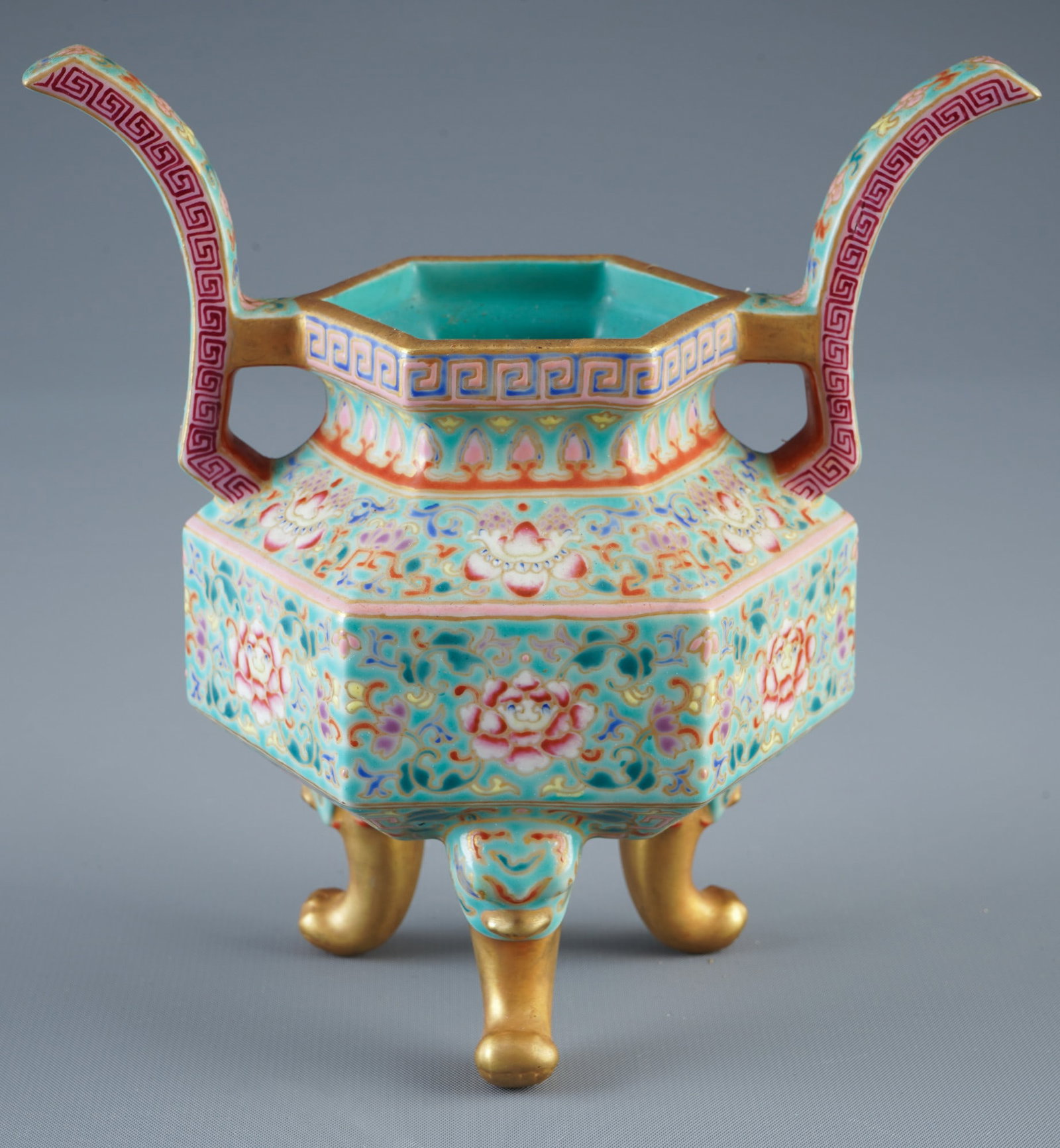 Famille Rose incense burner in the shape of a thing, China, 19th century,: Porcelain, China, 19th century, Famille Rose incense burner in a hexagonal shape, with two upright handles (bull's horns) and three feet, the entire body is covered with a turquoise-green base glaze a