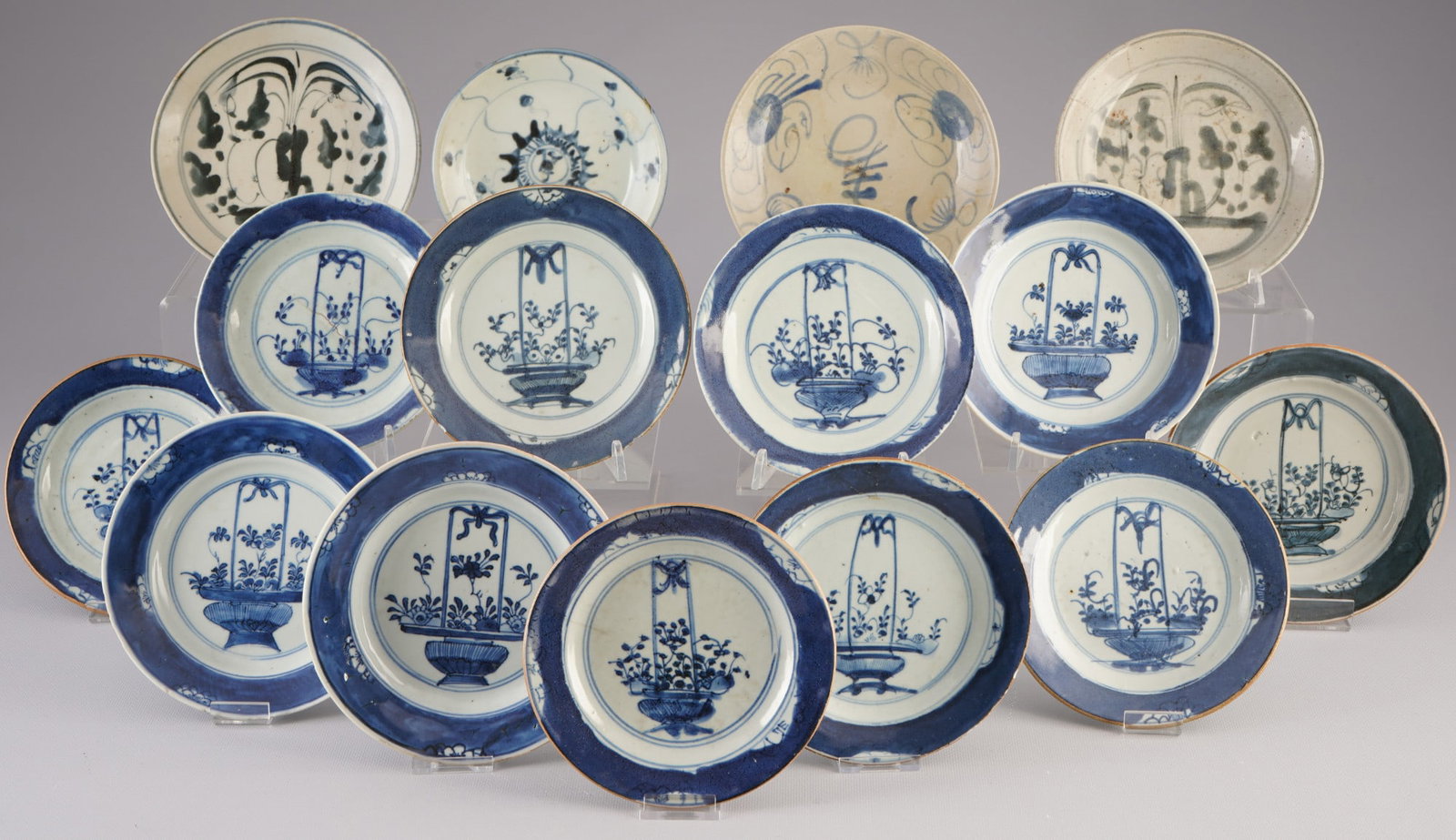 Collection of 15 blue and white plates, China, Qing Dynasty,: 15 porcelain plates, China, Qing Dynasty (1644–1911), fifteen blue and white plates with floral motif, D 16.3 cm – D 14 cm, cracks and chips