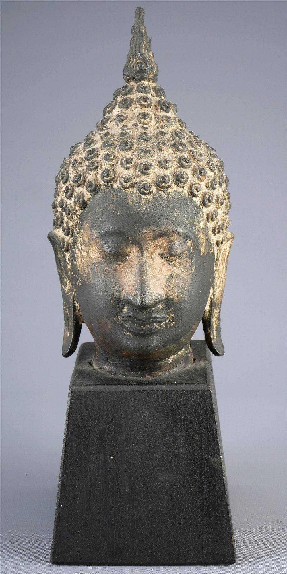 Bronze Buddha head on pedestal, Thailand (1 of 5)