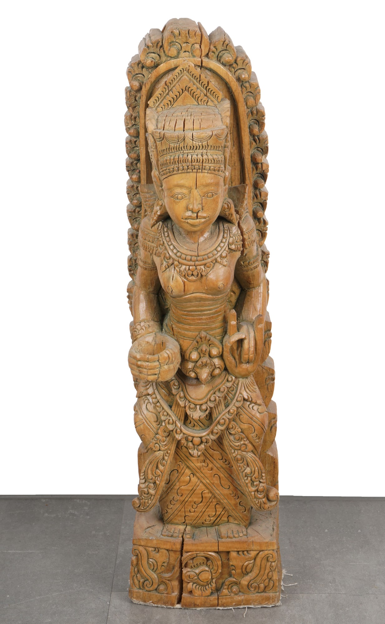 Large wooden figure of Lakshmi, Southeast Asia: Wood, Southeast Asia, probably Bali or India, early 20th century, wooden sculpture of a standing female deity Lakshmi, H 71 cm x W 19 cm x D 17.5 cm, wood cracks and chips, provenance: private collect