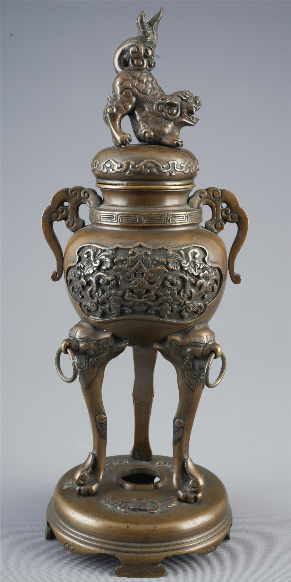 Bronze incense burner with lid and three feet, Japan, Meiji period,: Bronze, Japan, Meiji period (1868–1912), baluster-shaped body on an ornate three-legged base, relief depictions of birds, floral elements and curved ornaments, two side handles in the form of mythic