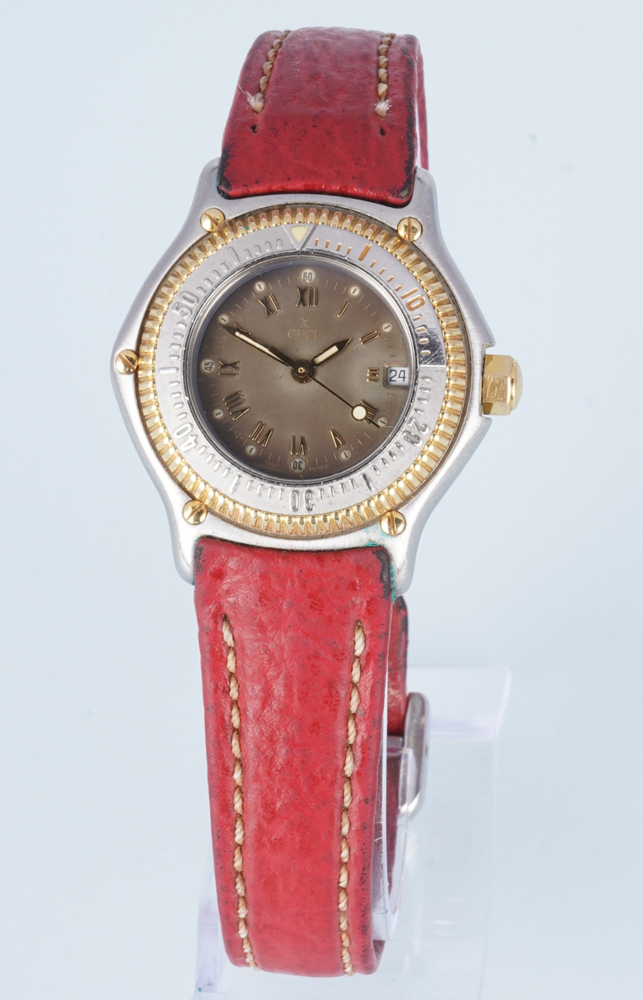Ebel Discovery Ladies' Wristwatch: Stainless steel/18kt yellow gold case, Discovery model, quartz movement, Ref. 183912, leather strap with decorative stitching, H 33 mm x W 32 mm (including crown), weight 40 grams, Ebel box and papers