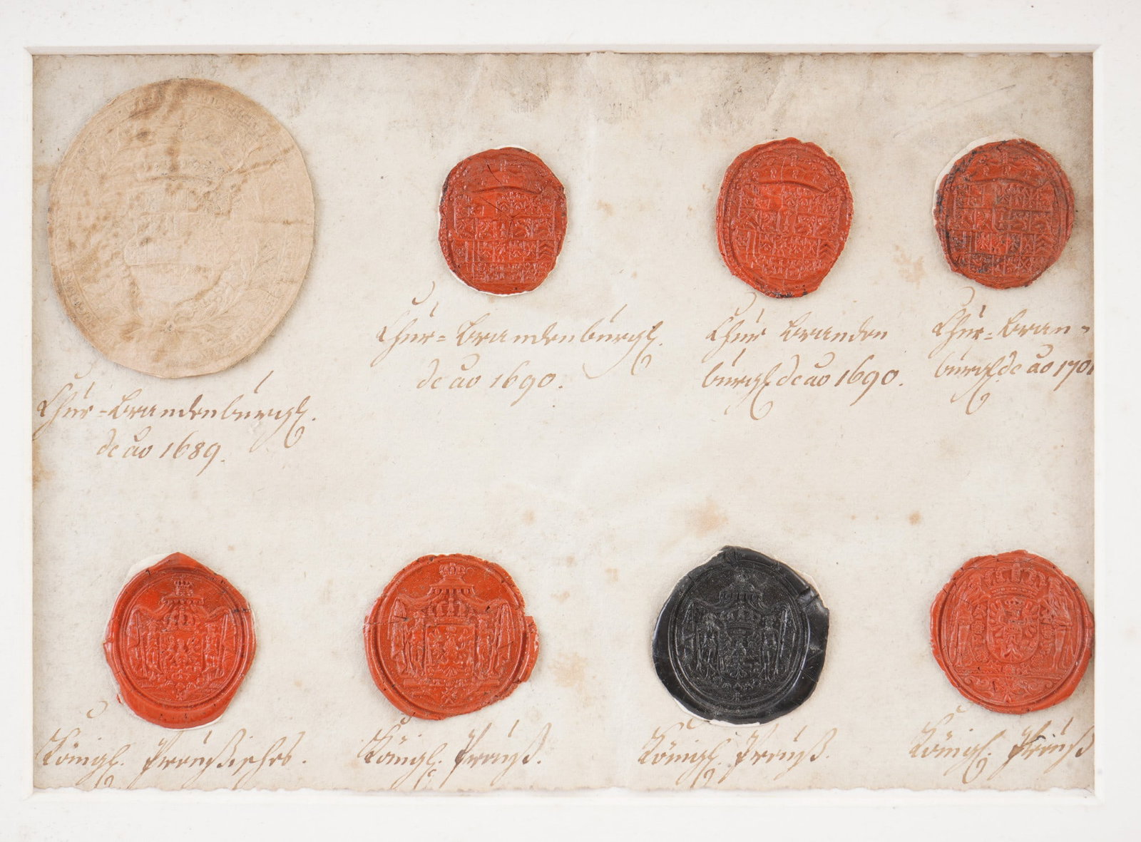 Collection of historical lacquer seal impressions dated 1689–1698,: A collection of eight seal impressions in red, black, and natural-colored sealing wax or paper, mounted on handwritten paper. The individual seals are inscribed with names and dates, including several