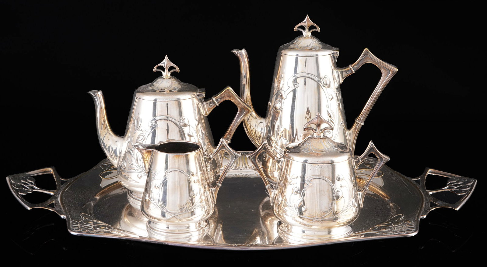 WMF Art Nouveau tea/coffee pot on tray circa 1920,: Metal (Britannia metal) / silver-plated and partially oxidized, Germany circa 1910/20, stamped I/= + OX + WMF company stamp, 5-piece tea and coffee set with characteristic floral Art Nouveau decoratio