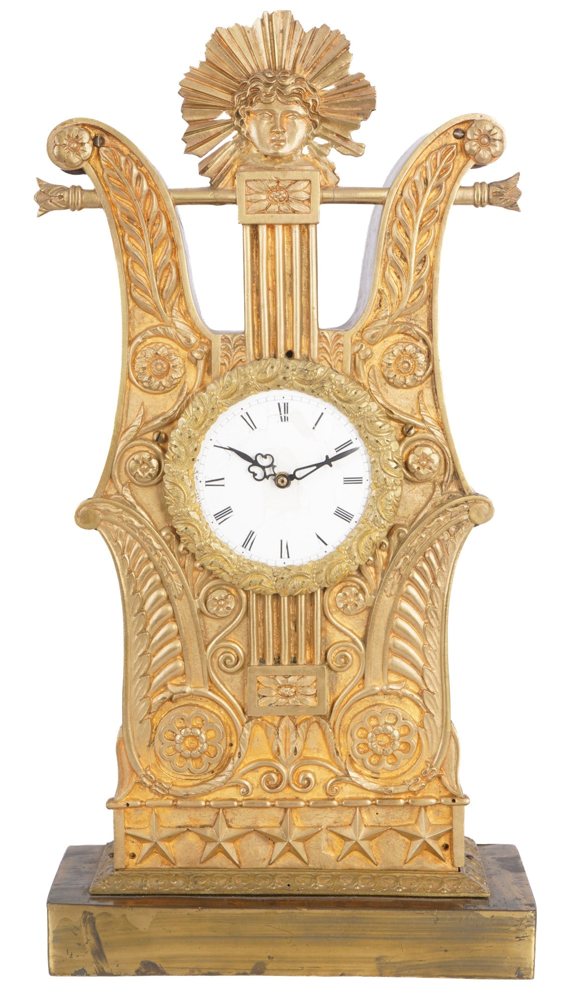 Empire bronze portal clock with Apollo head, France 1820-1850: France, early 19th century, H 40.5 cm x W 20.5 cm x D 8 cm, weight 2.7 kg, wood with rich bronze front, lyre shape with palmettes and rosettes, crowned by Apollo head with radiant halo, white enamel d