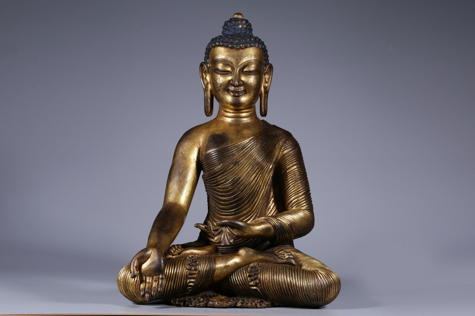 Sitting bronze gilt statue of Sakyamuni in Qing Dynasty (1 of 9)
