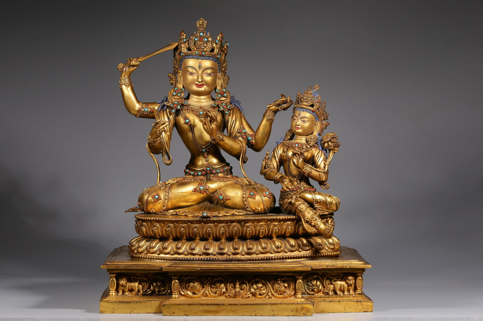 A double figure of Manjusri Bodhisattva inlaid with hundreds of treasures in gilt copper in the Qing (1 of 9)