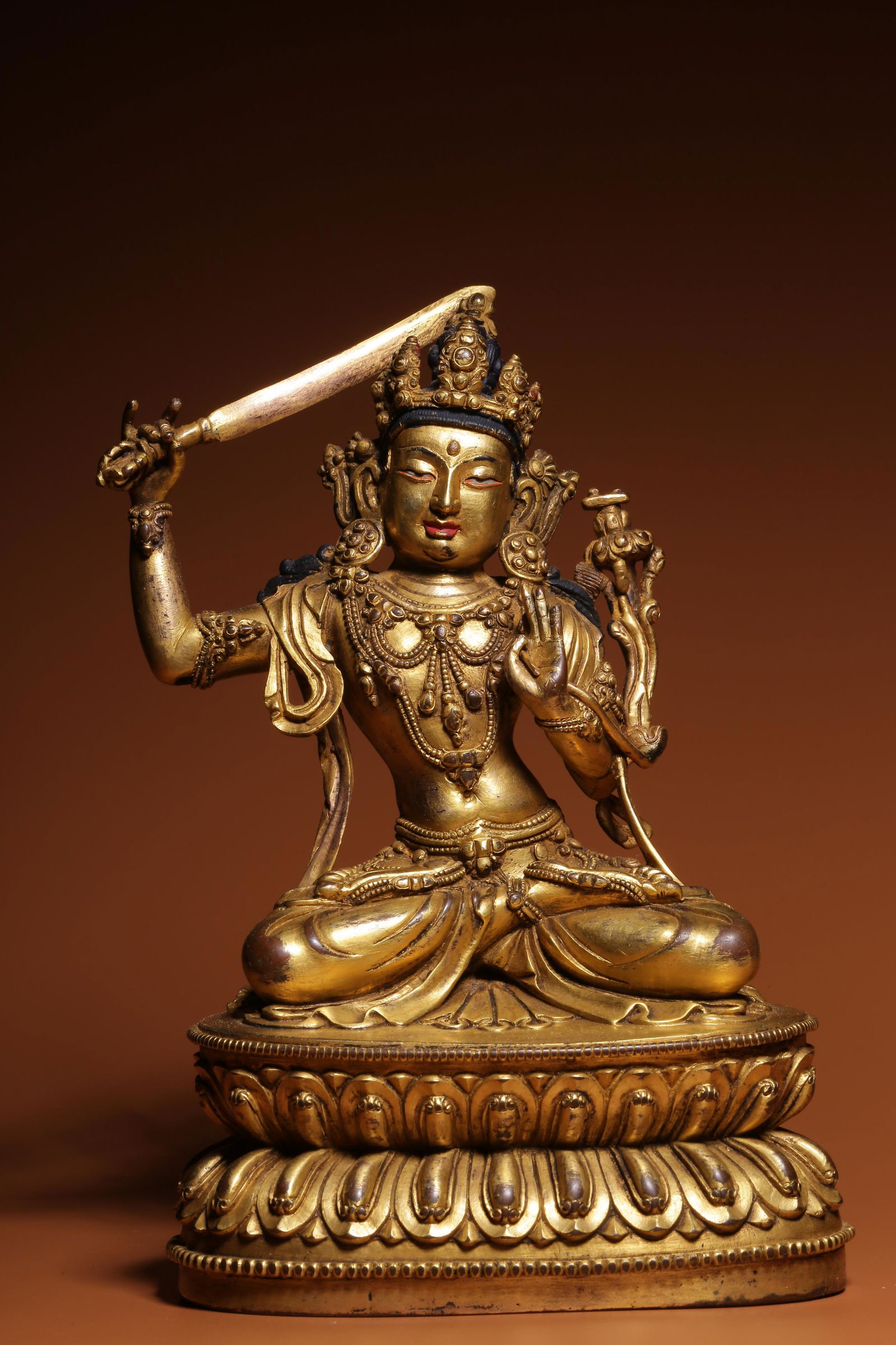 Sitting bronze gilt statue of Manjusri Bodhisattva in Qing Dynasty (1 of 7)