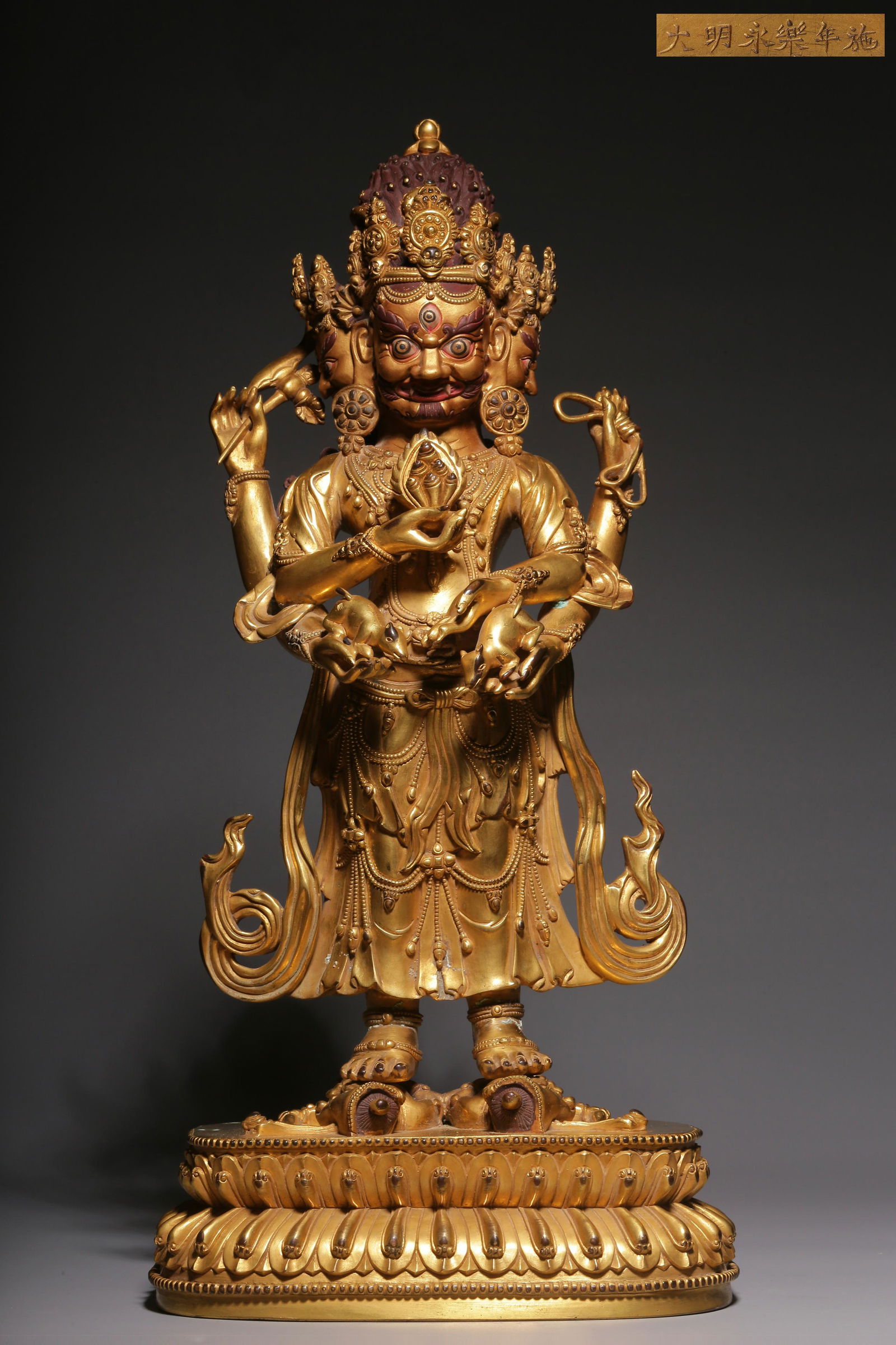 "Daming Yongle year" type gilt bronze statue of the God of wealth on three sides and six arms (1 of 9)