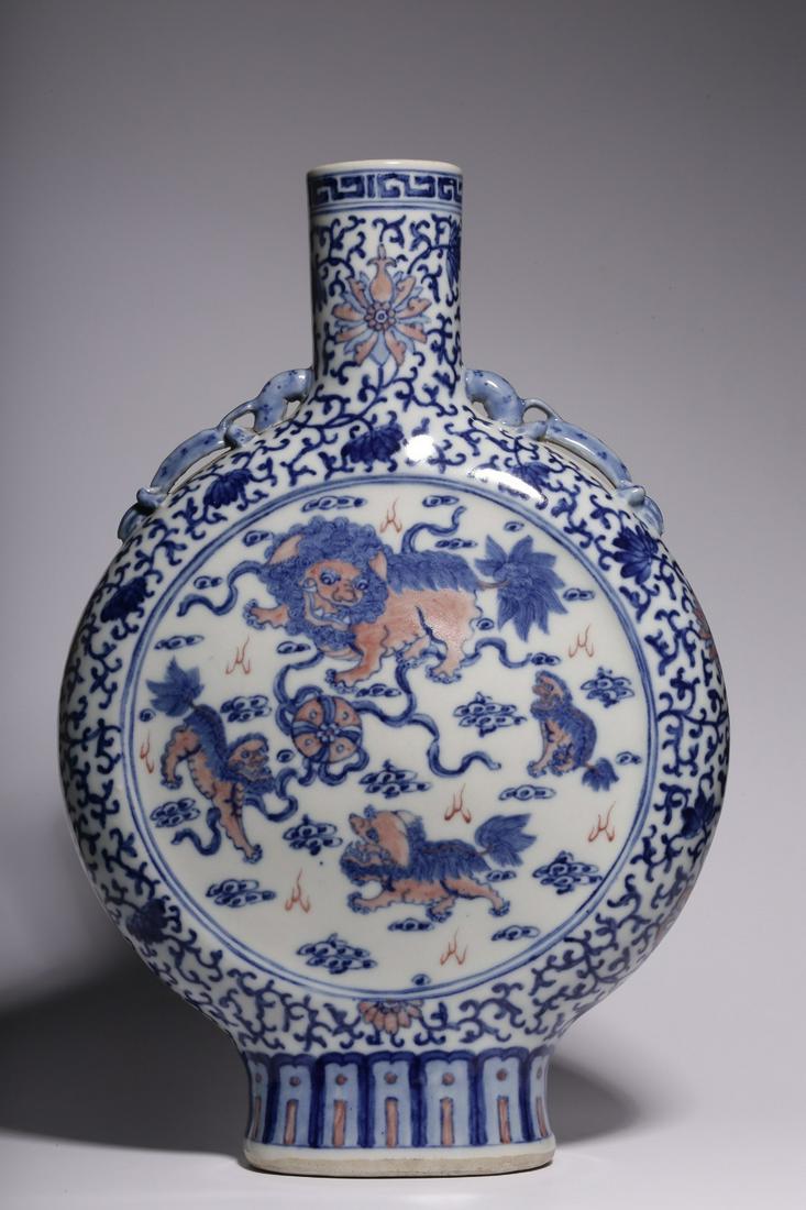Qing Dynasty, "Kangxi year" blue and white lion play ball figure flat bottle (1 of 9)