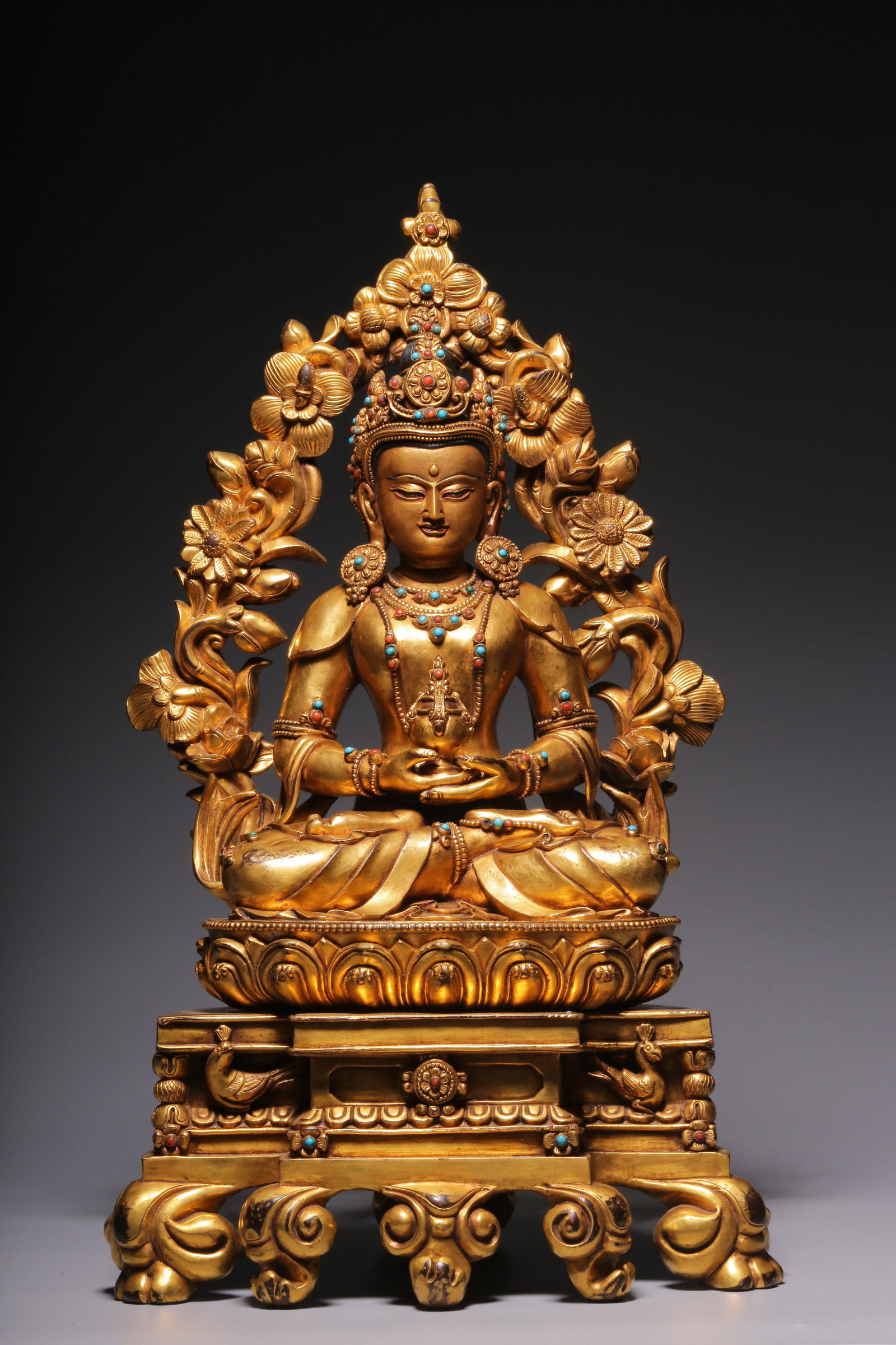 In the Qing Dynasty, a sitting statue of longevity Buddha inlaid with treasure and gilt copper (1 of 9)