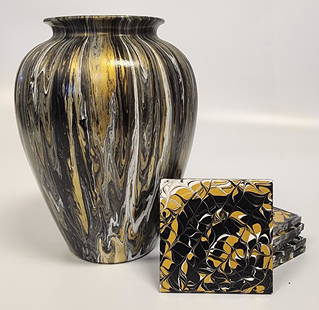 Gold and Black Abstract Fluid-Art Vase with Set of Coasters: Glass vase with gold and black paint in abstract fluid-art style and set of coastersLocal Artist: Alex WilliamsDimensions:Vase: 10 H x 7 W in (at widest)Coasters 4 H x 4 W inAll proceeds from our