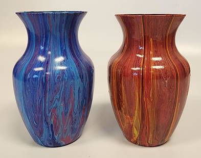 Set of Two Abstract, Fluid-Art Glass Vases: Set of two abstract fluid-art acrylic-painted glass vases with flared necksLocal Artist: Alex WilliamsDimensions: 8 H x 5 W in (each)All proceeds from our auctions support the mission of the Dorian