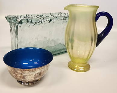 Irridescent Green Glass Pitcher with Reed & Barton, Silverplate, Blue Enamel Bowl and Handblown: Reed & Barton 104 silverplate, blue enamel bowl, together with a Fenton vaseline topaz yellow water pitcher with cobalt blue handle and a hand blown glass long vase Dimensions:Bowl: 3 H x 7 W