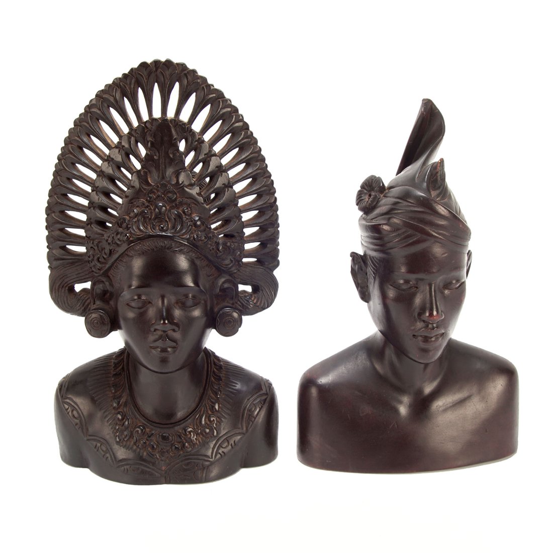 Balinese Hand Carved Wooden Couple Bust Sculptures: Hand carved wooden Balinese busts scuplture made of ebony. Handcrafted in Bali, this is a bust depicting a Balinese couple wearing traditional ceremonial clothing with intricate details. Dimensions Wo