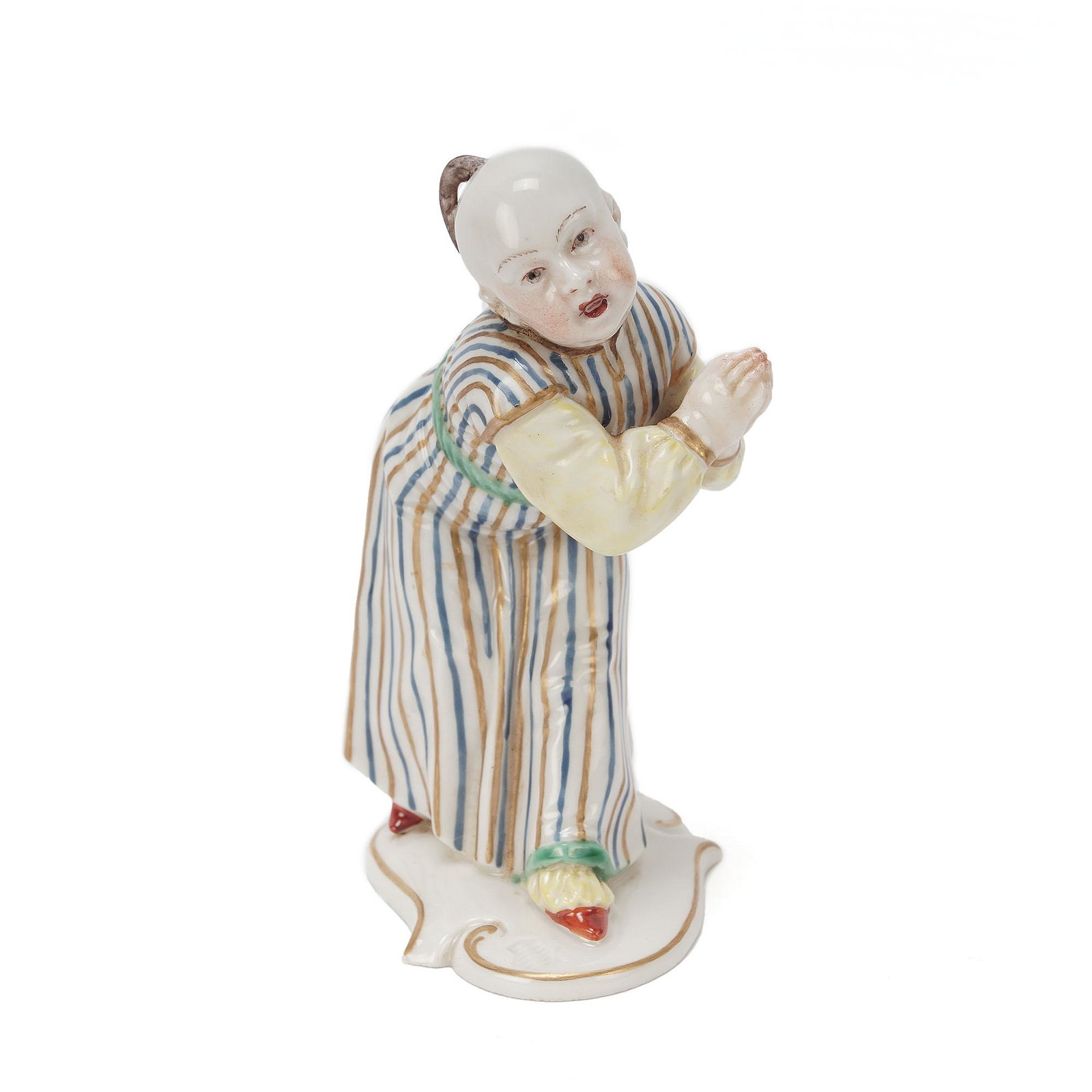Nymphenburg Porcelain Chinese Figurine: Nymphenburg porcelain figurine of a Chinese boy pleading. The figurine is on a curved base, polychrome painted, with a blue and gold striped robe. Made in Germany with the numbers 67 etched on the top