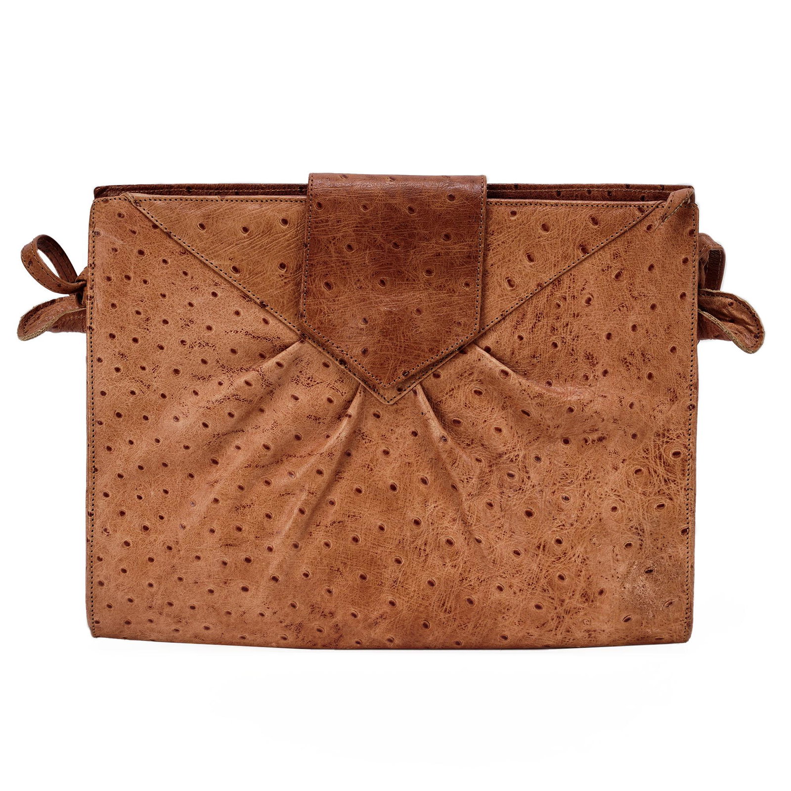 Genuine Versani Ostrich Tan Crossbody Purse: Versani genuine ostrich tan crossbody purse with brown felt lining inside. There is a snap closure on the outside of bag and a zipper to open inside. The inside has one zipper compartment. The straps 
